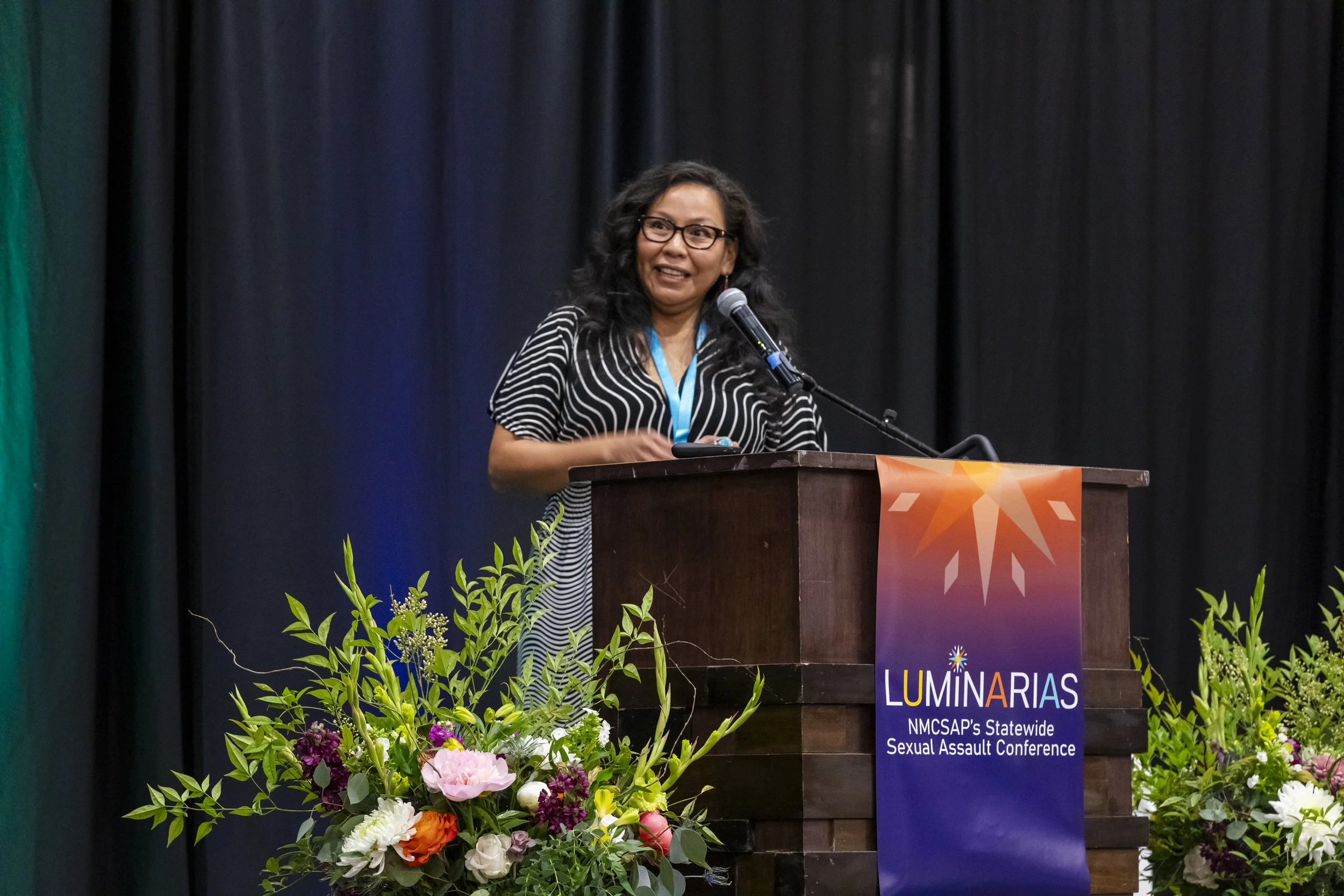 A woman speaking at a podium