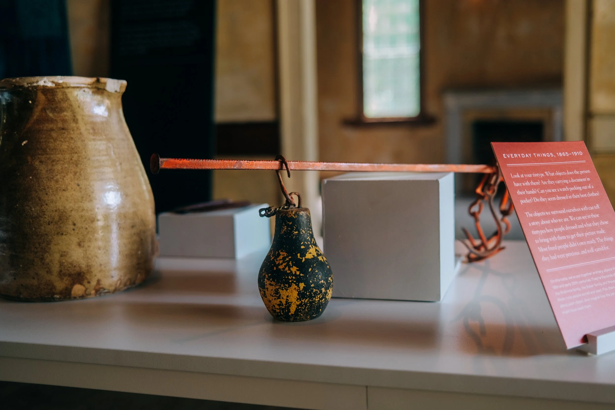 Artifacts on the table of the "Out of Whole" cloth exhibit