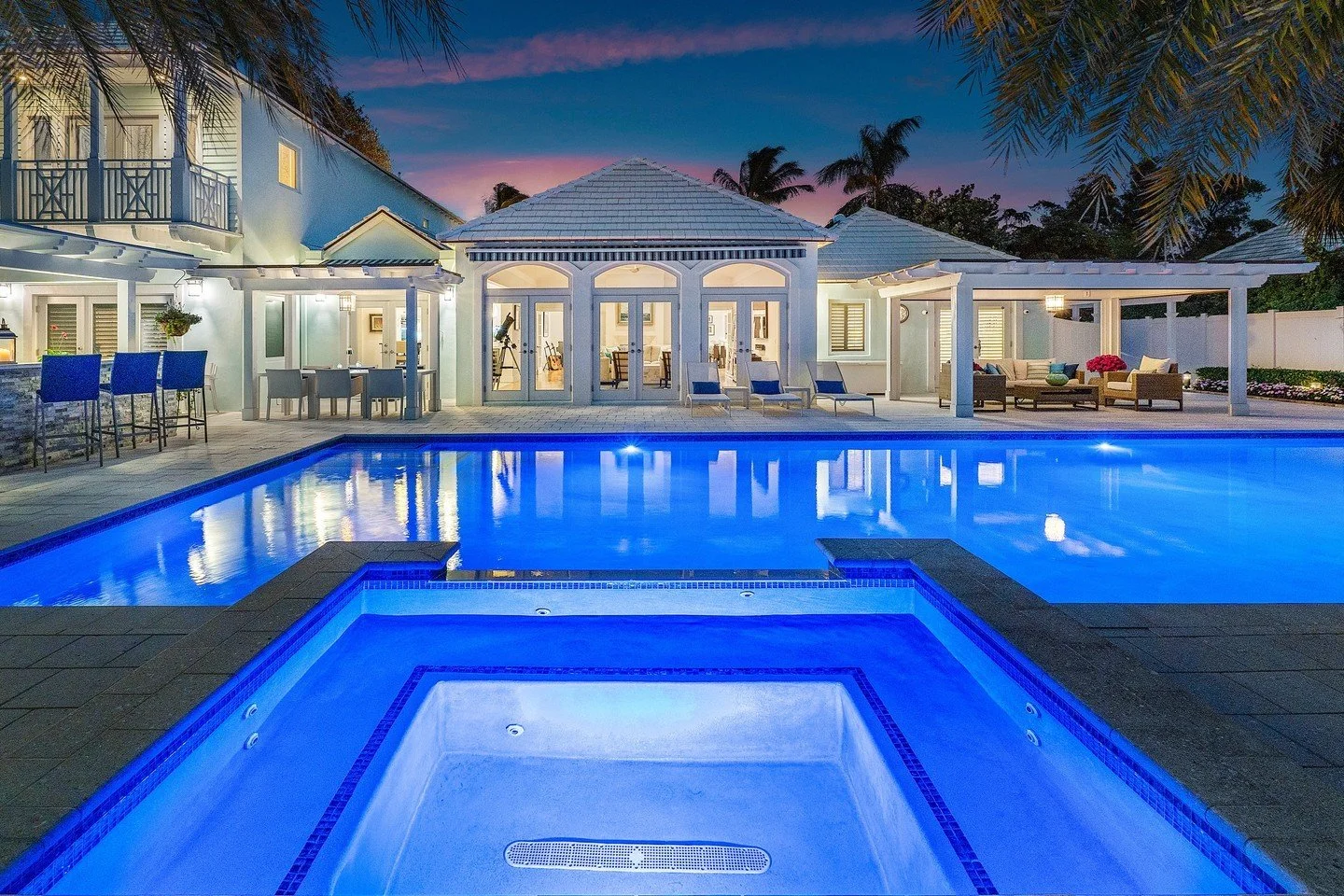 Nestled in the beautiful Palm Trail area, this outdoor pool area truly captures the essence of South Florida living! When the lights come on, the space transforms into a magical retreat, perfect for evening swims or unwinding by the water.

The ambie