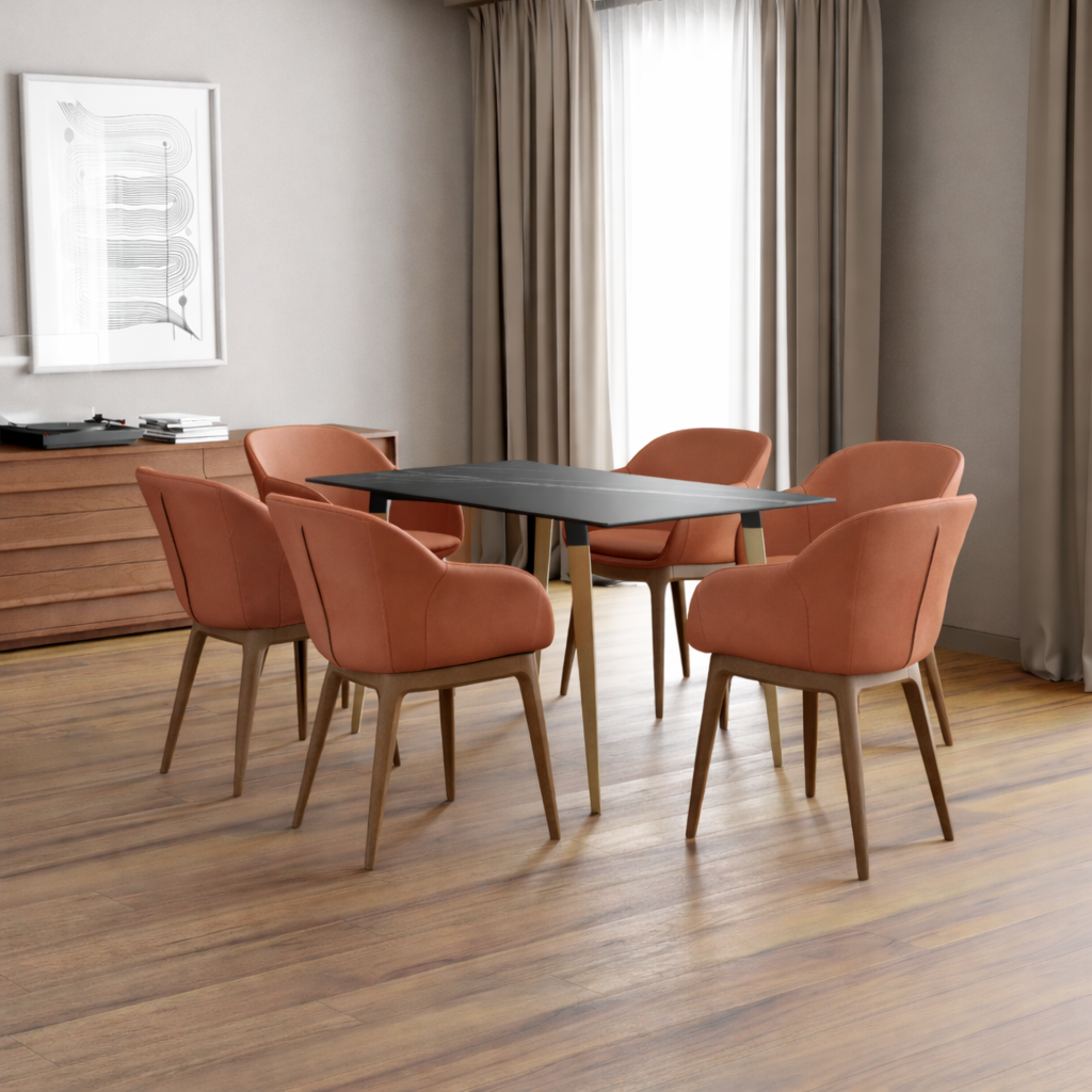 Orange chairs sitting around a table
