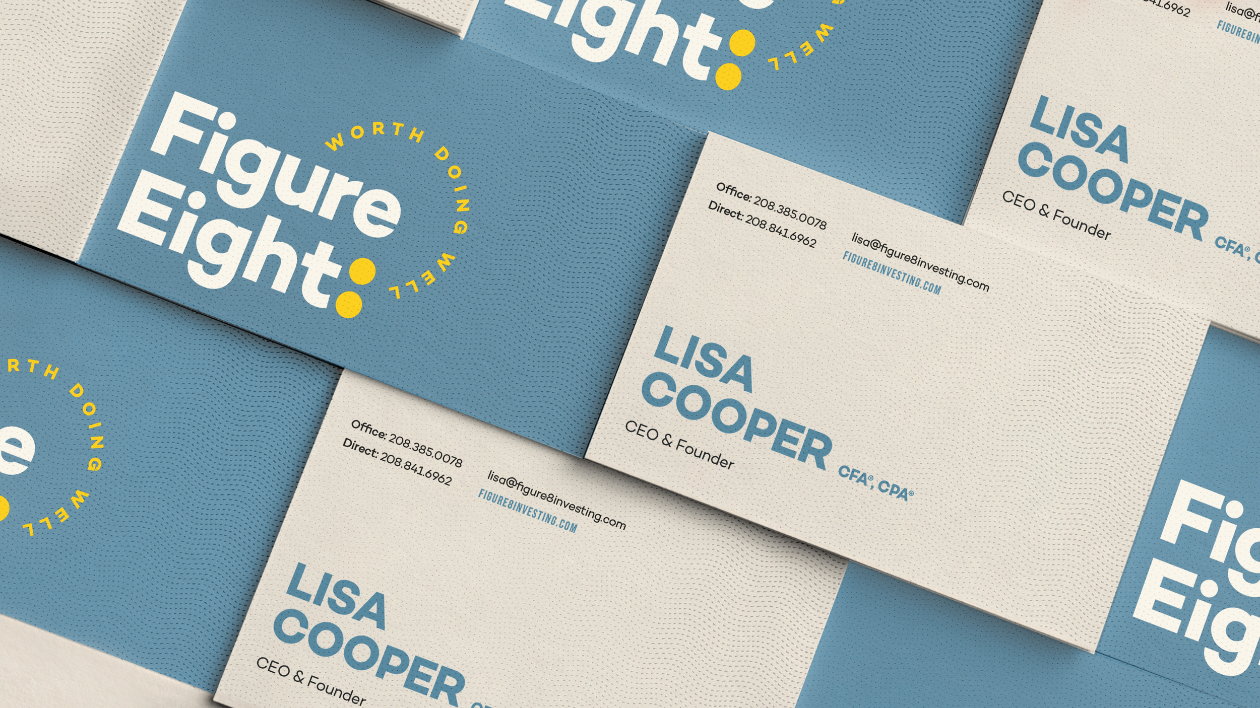 Business cards for Figure Eight featuring text with name Lisa Cooper, CEO & Founder, contact information, and company logo.