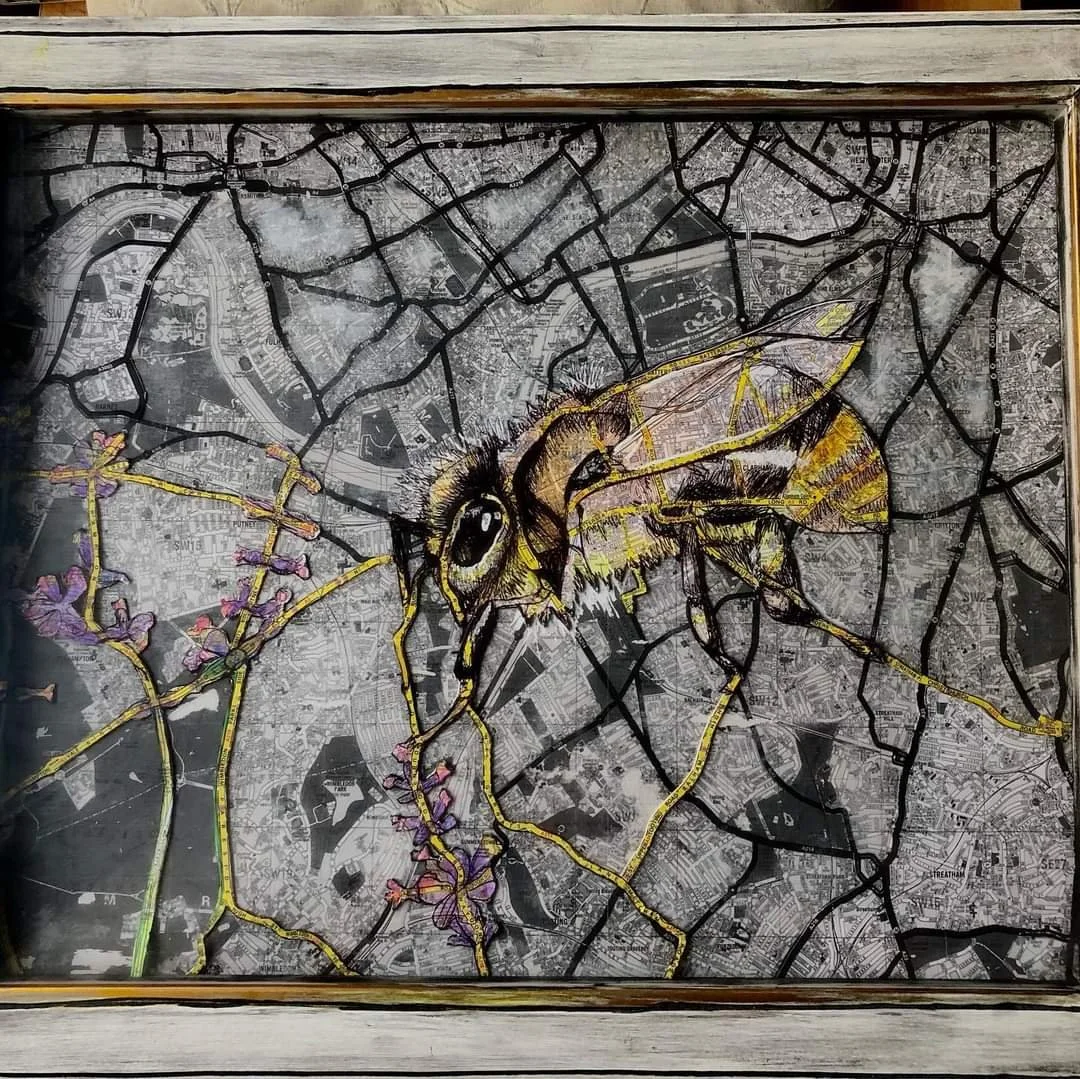 Artistic depiction of a bee on a cracked city map background with flowers. Museum-quality framing in the UK
