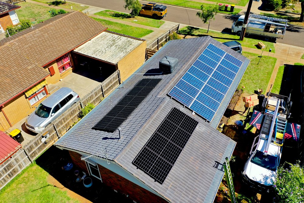 Aerial view of Lily's home with solar panels