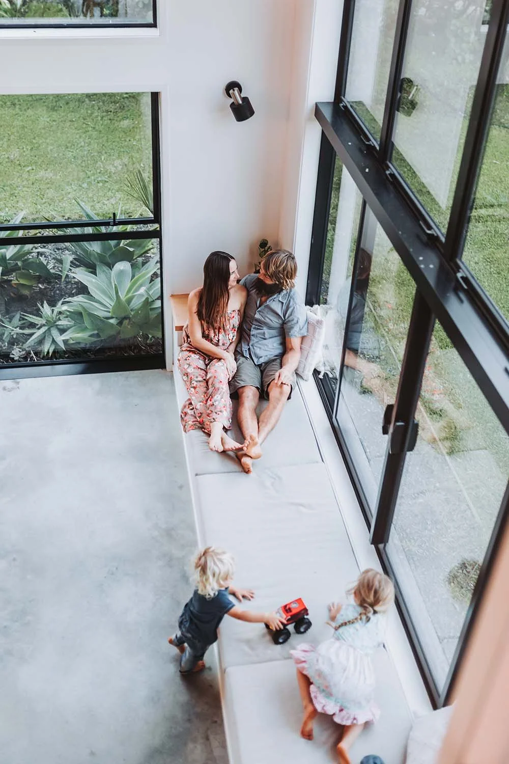 Family photoshoot at home playing with toys