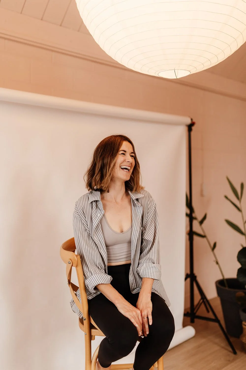 Headshot image of business woman sitting on chair