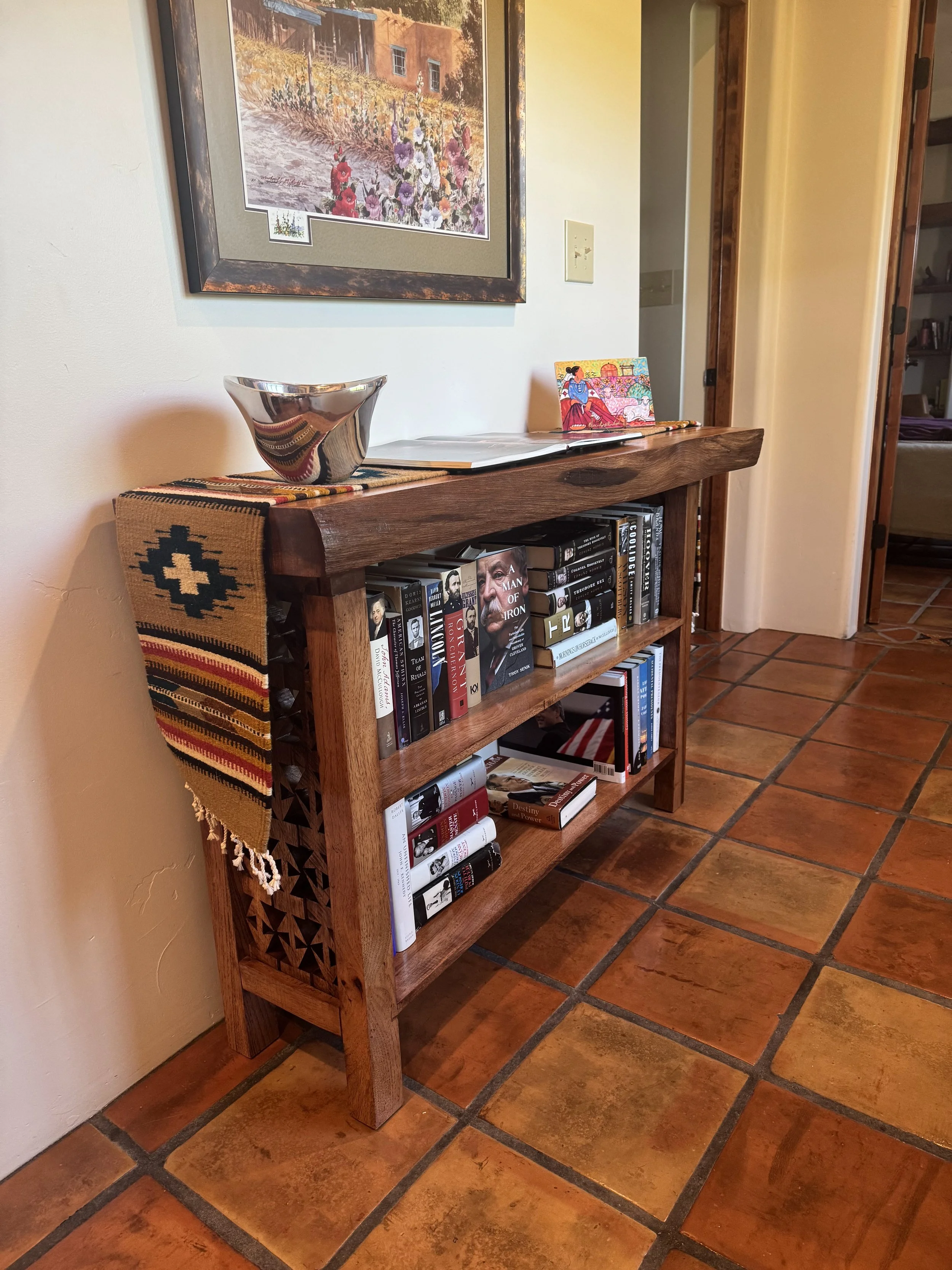 Fully stocked Pecan wood bookcase done in a traditional southwestern New Mexico style.