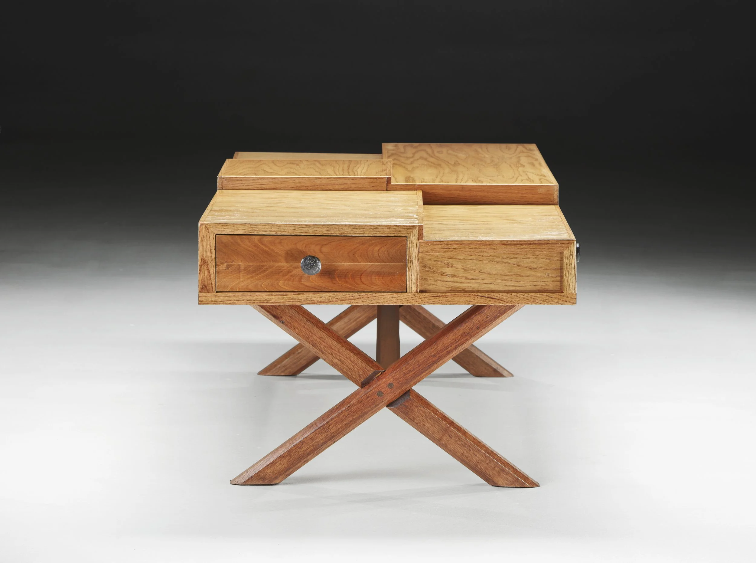 Modern coffee table with stepped top and surround drawers.  Oak and cypress construction.