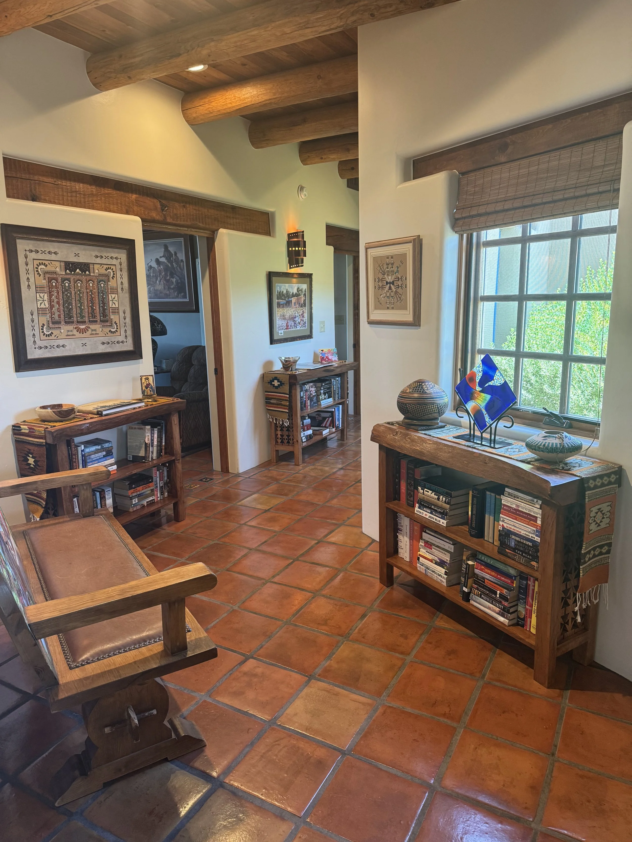 Fully stocked Pecan wood bookcase done in a traditional southwestern New Mexico style.
