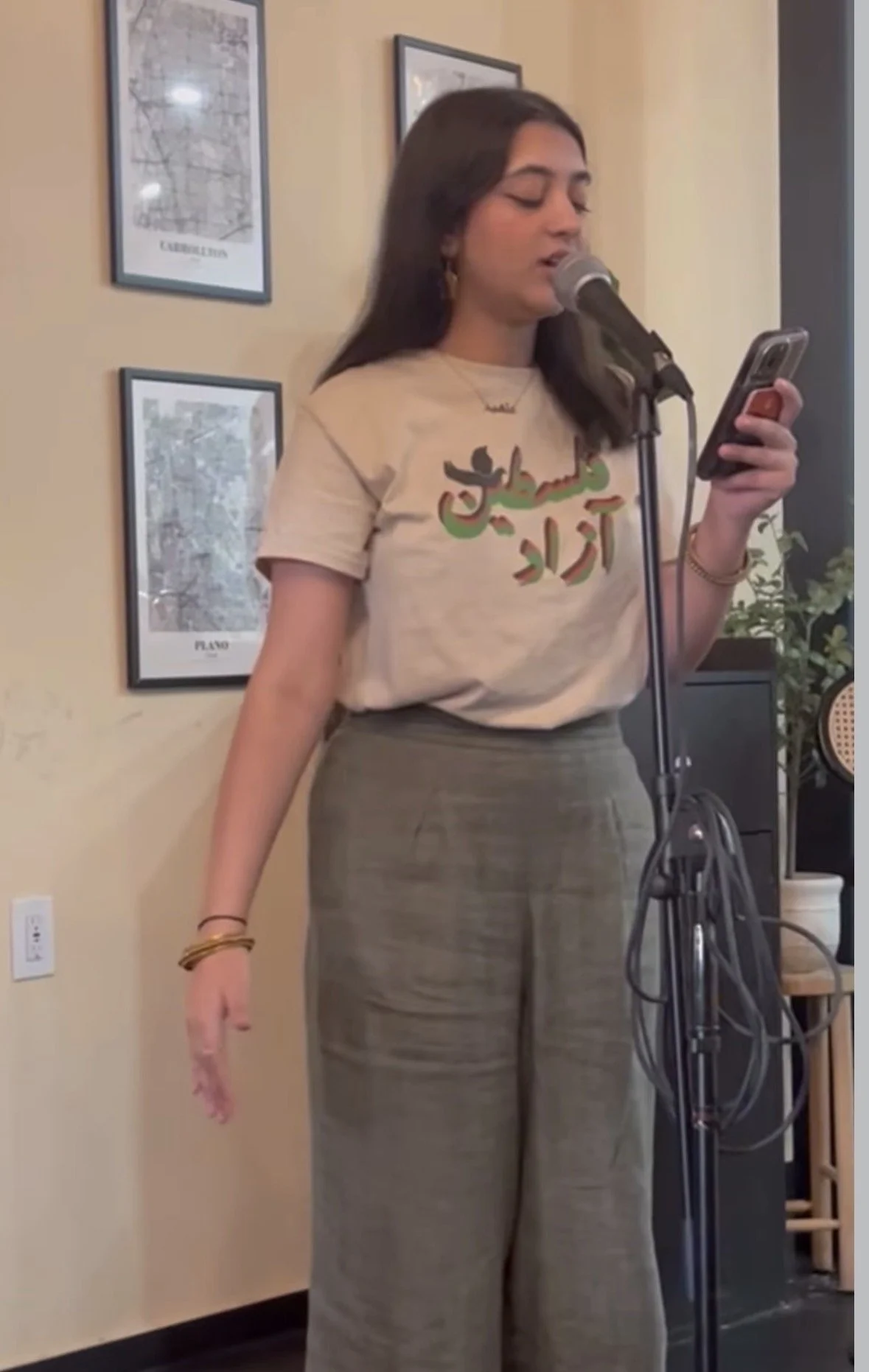 Performing at an Asian American Poetry night around language at Hold My Chai in Frisco.