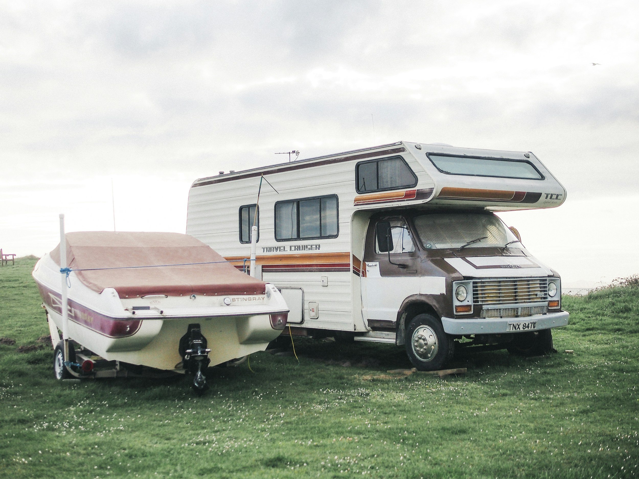 Boat and RV parked on grass