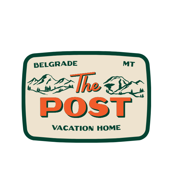 A sign reading "The Post Vacation Home" with mountain and tree illustrations, indicating a location in Belgrade, Montana.