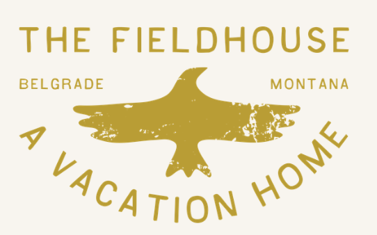 Logo for The Fieldhouse with a central eagle silhouette, and the words Belgrade, Montana, and A Vacation Home surrounding it.