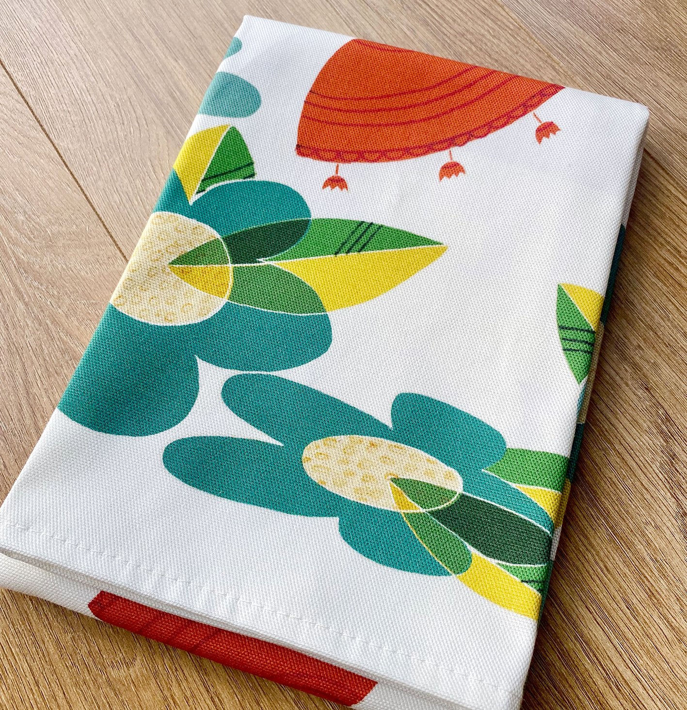 elliegoodillustration_retrofloral_teatowel_folded-on-wood-WEB.jpg