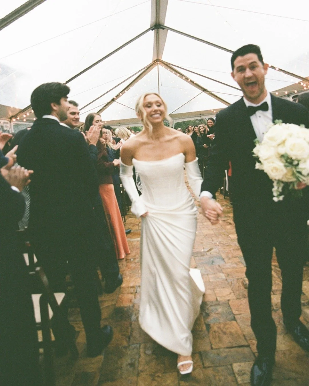 Rain stopped zero fun for Taylor and Eamon. 

@cielbleuevents - Wedding Planning &amp; Design
@ravawinesweddings - Venue
Matrimony Media - Photography &amp; Videography
@draping_bykim - Draping
@torricella_catering - Catering
The Lucky Devils - Live 