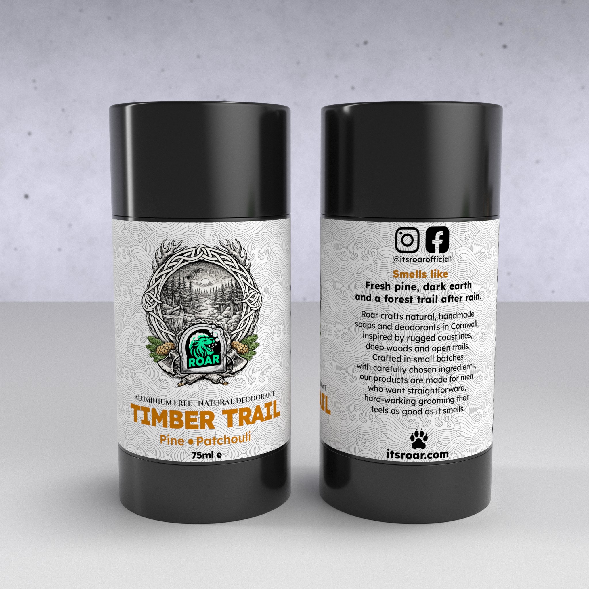 Two black cylindrical containers of ROAR Timber Trail natural deodorant with white labels and black caps. The front label features a mountain landscape illustration, a lion logo, and product name in orange text, with descriptions of scent and ingredients. The back label contains website, social media icons, scent description, and product details.