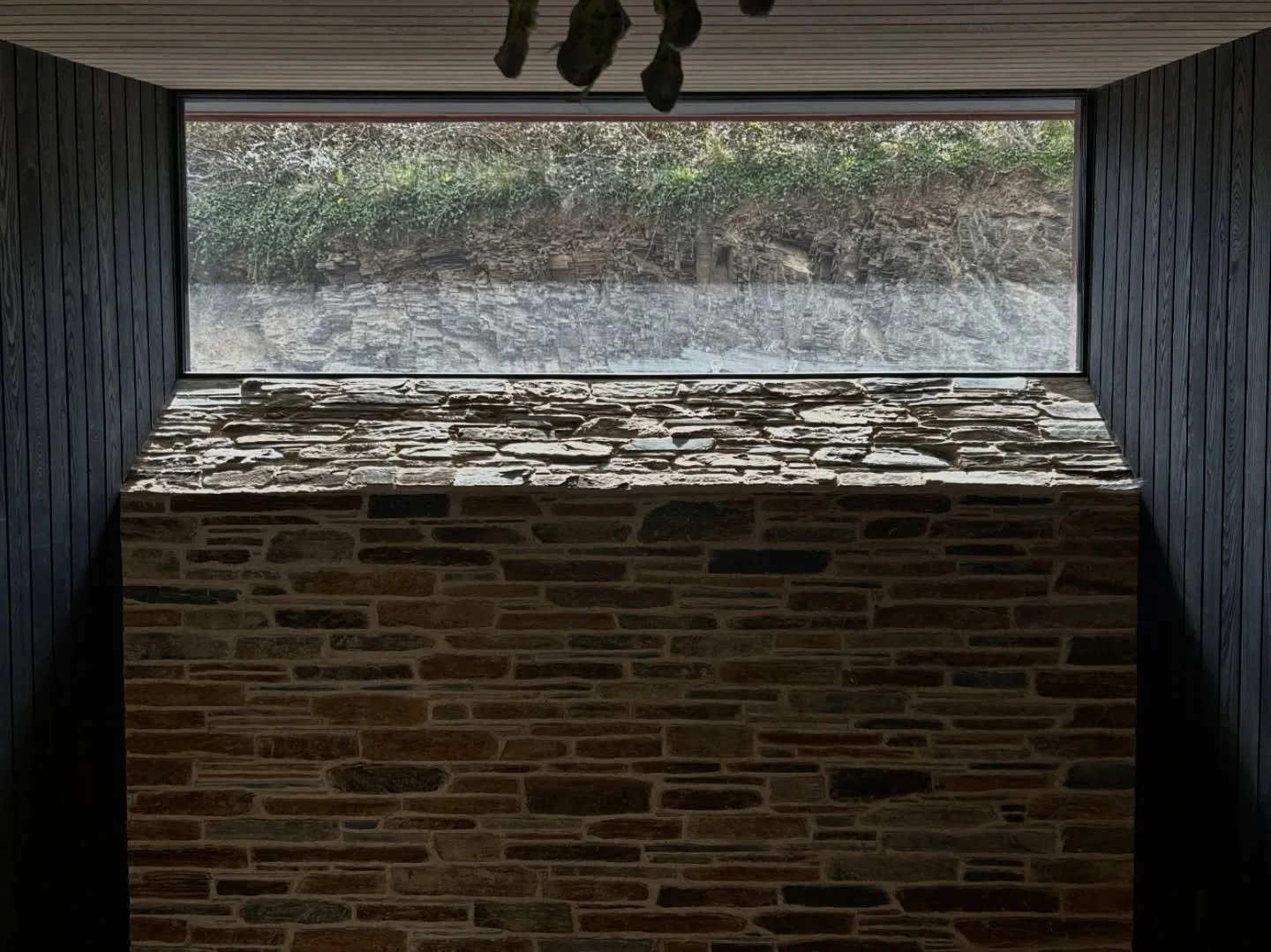 This bespoke stone windowsill was commissioned to give the impression of a solid stone wall - and completely transform the space.

Each piece was precisely cut to a 40mm depth, with the bottom course mitred to act as a keystone, locking the upper sto