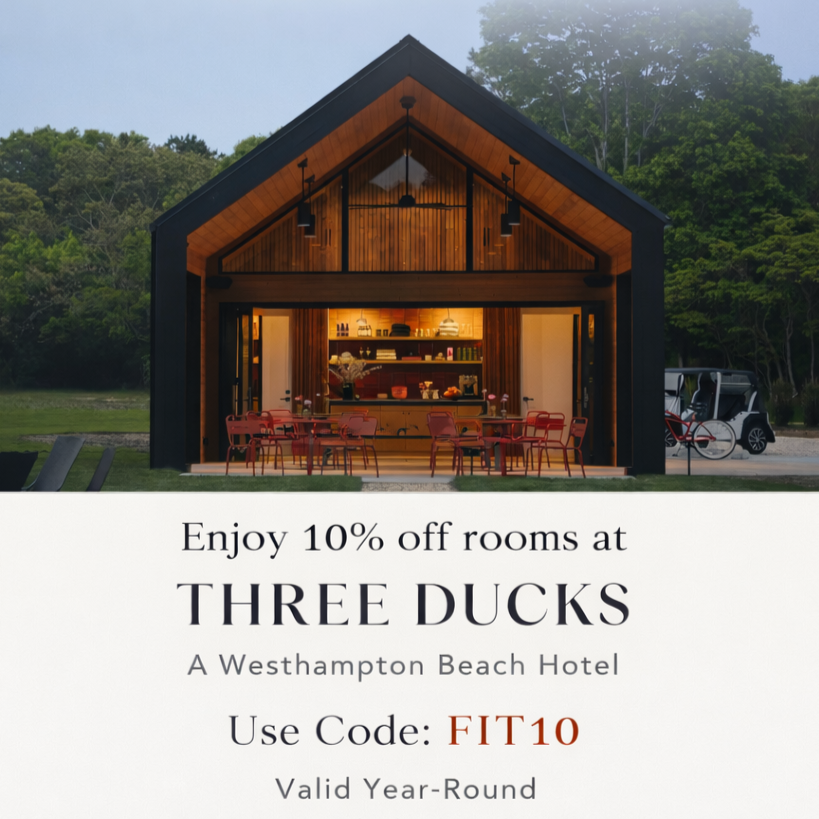 A modern beachside hotel with a large open lobby, surrounded by green trees. Promotion for 10% off rooms at Three Ducks hotel with code FIT10, valid year-round.