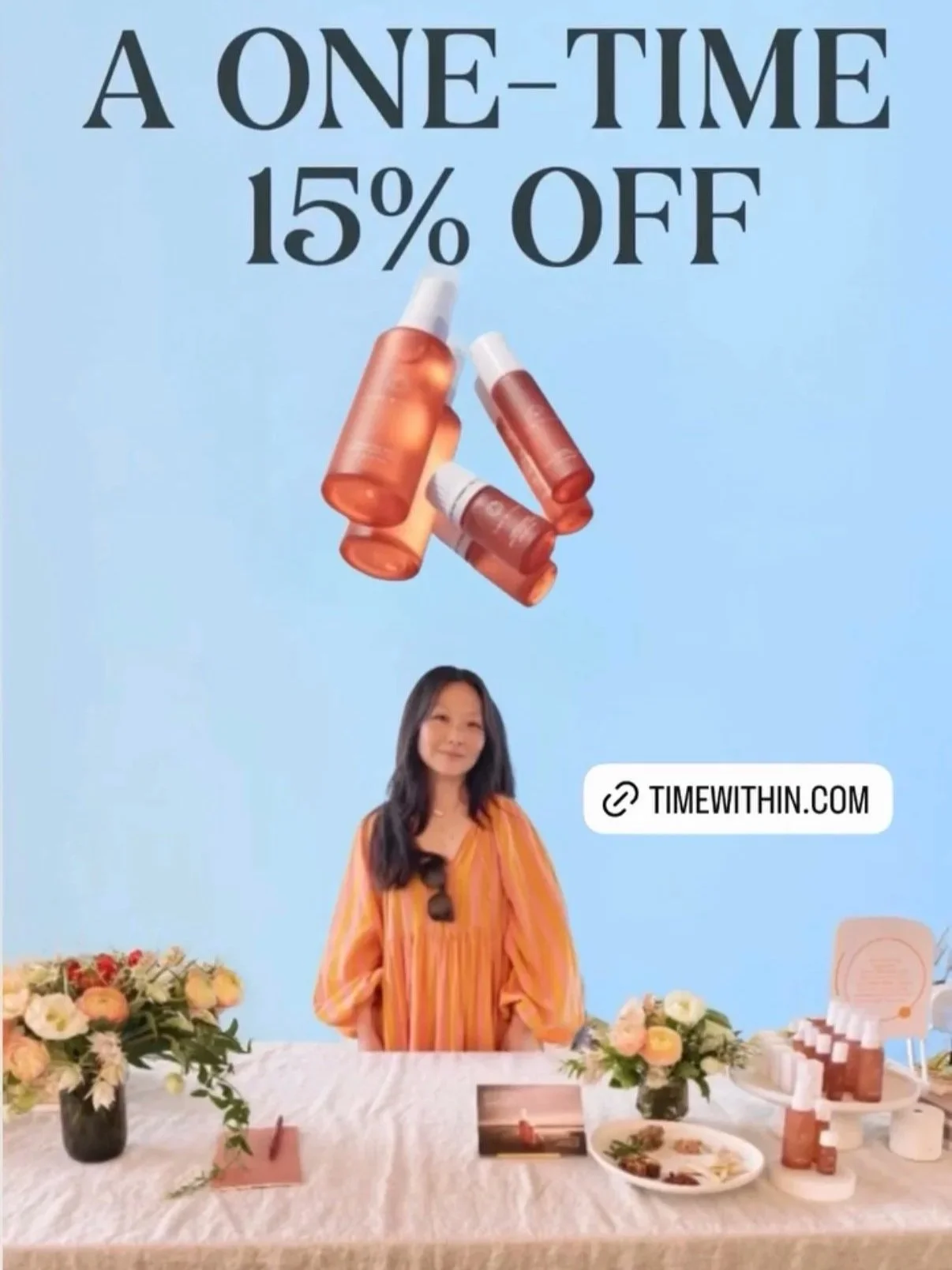 A promotional image advertising a 15% discount on products, featuring bottles and a woman sitting at a table with flowers and products displayed.