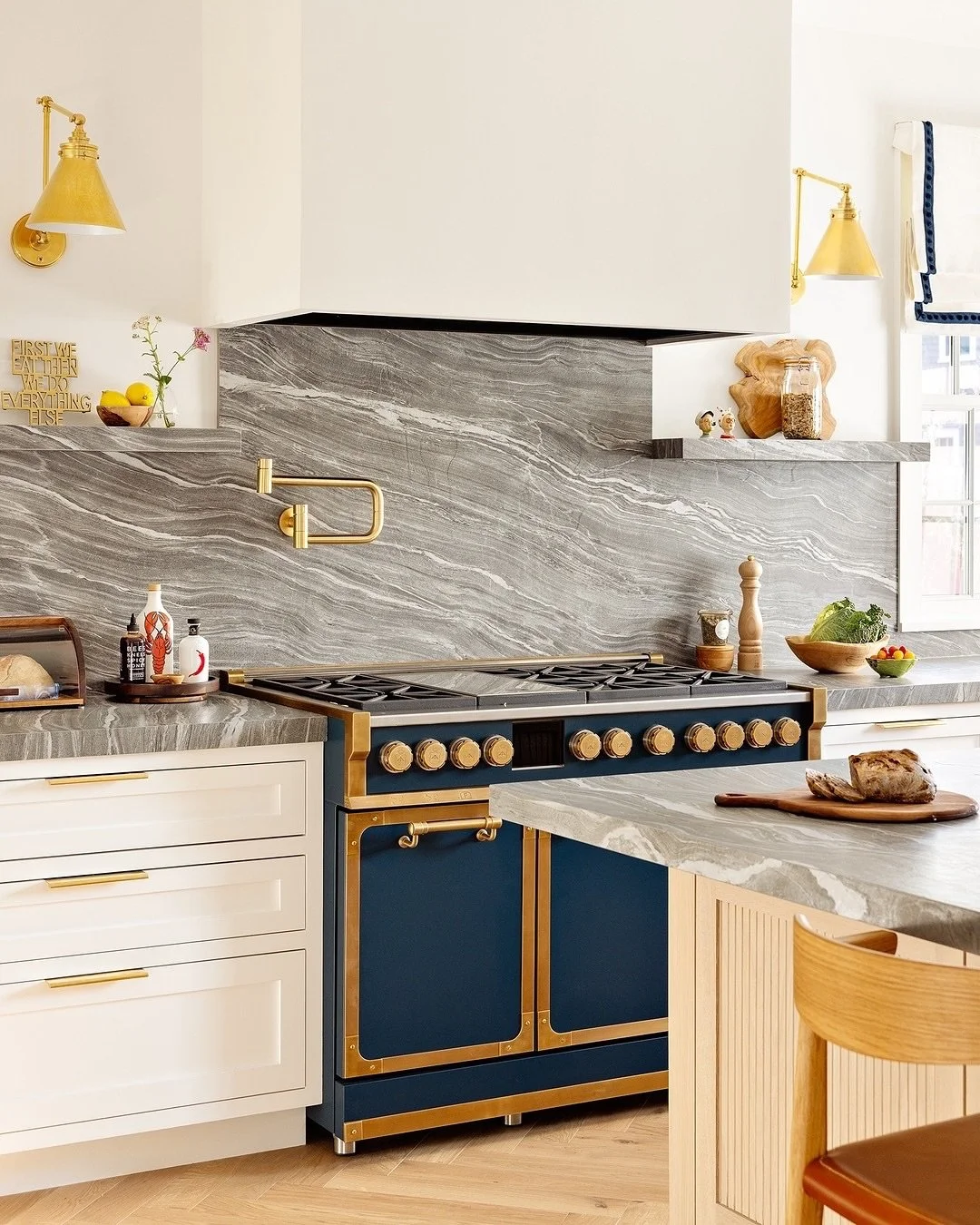 Our Nantucket kitchen featuring a stunning @officine_gullo range cooker 💛
⠀⠀⠀⠀⠀⠀⠀⠀⠀
The kitchen counter and stove top is a Neolith which was supplied by @marbleandgraniteinc
Wall lights are @visualcomfort 
Handles are @turnstyledesigns
⠀⠀⠀⠀⠀⠀⠀⠀⠀
In 
