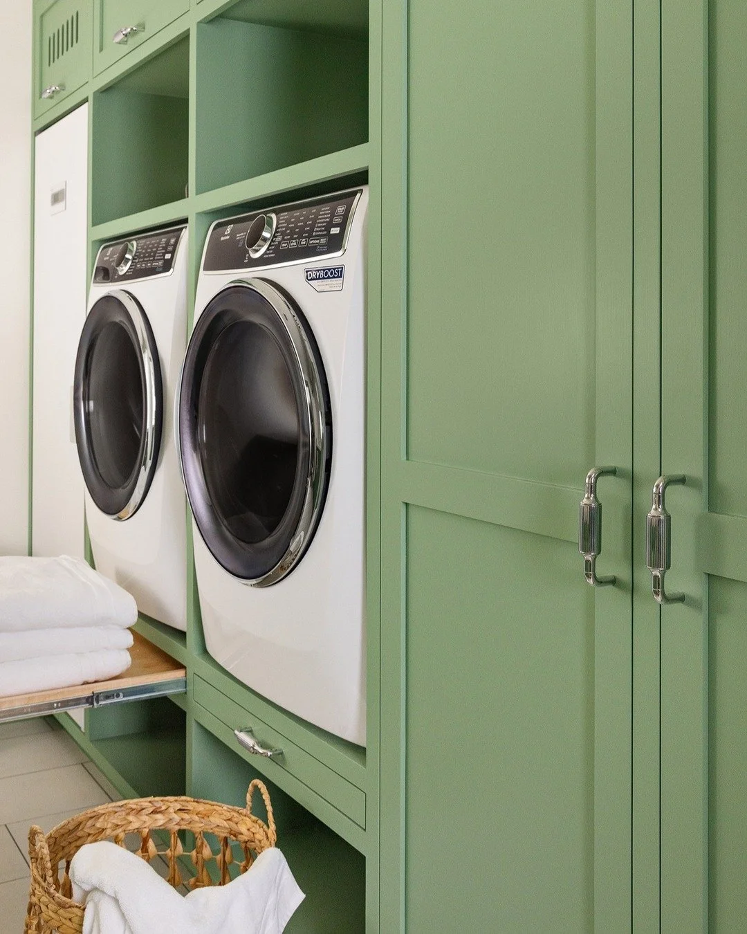 Winter Sage by @BenjaminMooreuk and @armacmartin hardware on the cabinetry in our Nantucket utility room. We specified pull out trays for making unloading the washer and dryer super easy and they are positioned at the perfect height with plenty of sp