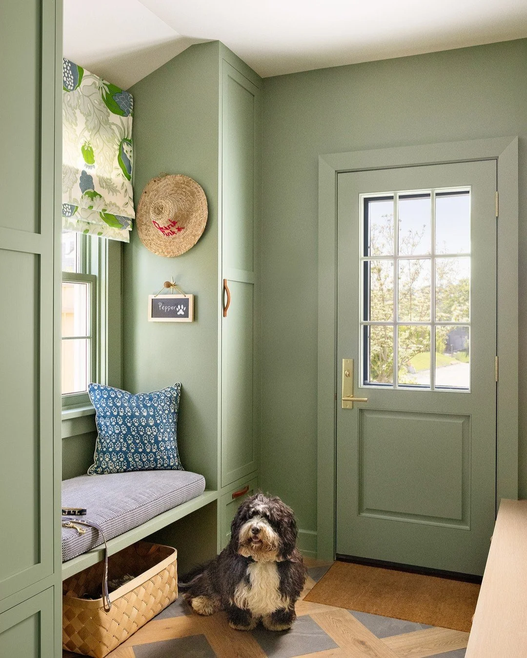 A mud room of dreams featuring our client's pooch @iampepperthedog and their amazing collection of beach bags, baskets and hats! The beautiful green paint is @benjaminmoore Summer&rsquo;s Day 

Photos by @hayleyellenday 💚

-

#mudroom #nantucketsumm