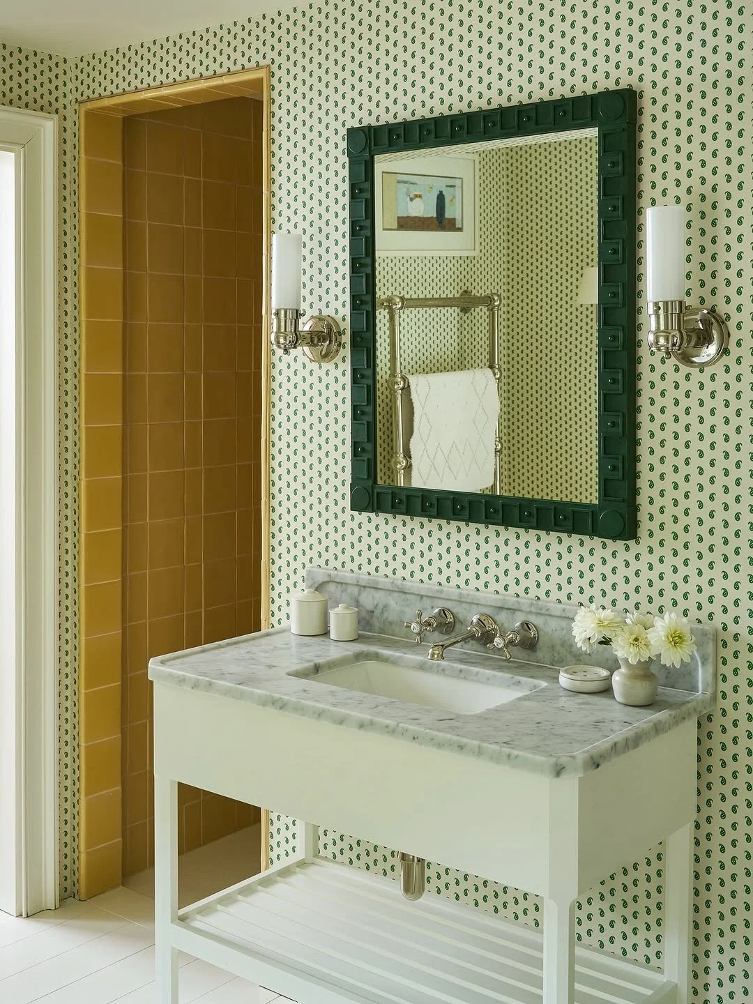 An elegant bathroom designed by @studio_atkinson their beautiful Greek Key Mirror hung over @howe.36bournestreet Mr Men wallpaper - an excellent combo! 💚

-

#bathroom #marblevanity #wallpaperbathroom #mrmenwallpaper #elegantbathroom #marblewashstan