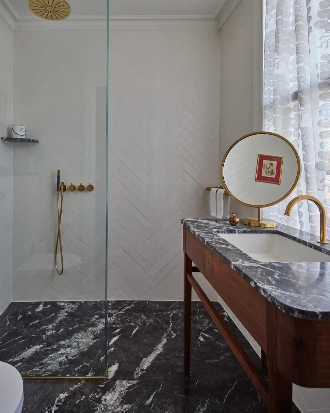 Bathroom before and after (swipe for the before!)

We blocked off the door to what was originally a Jack and Jill bathroom and reconfigured the space, removing the bath and adding in a generously sized shower and custom vanity unit. It no longer feel