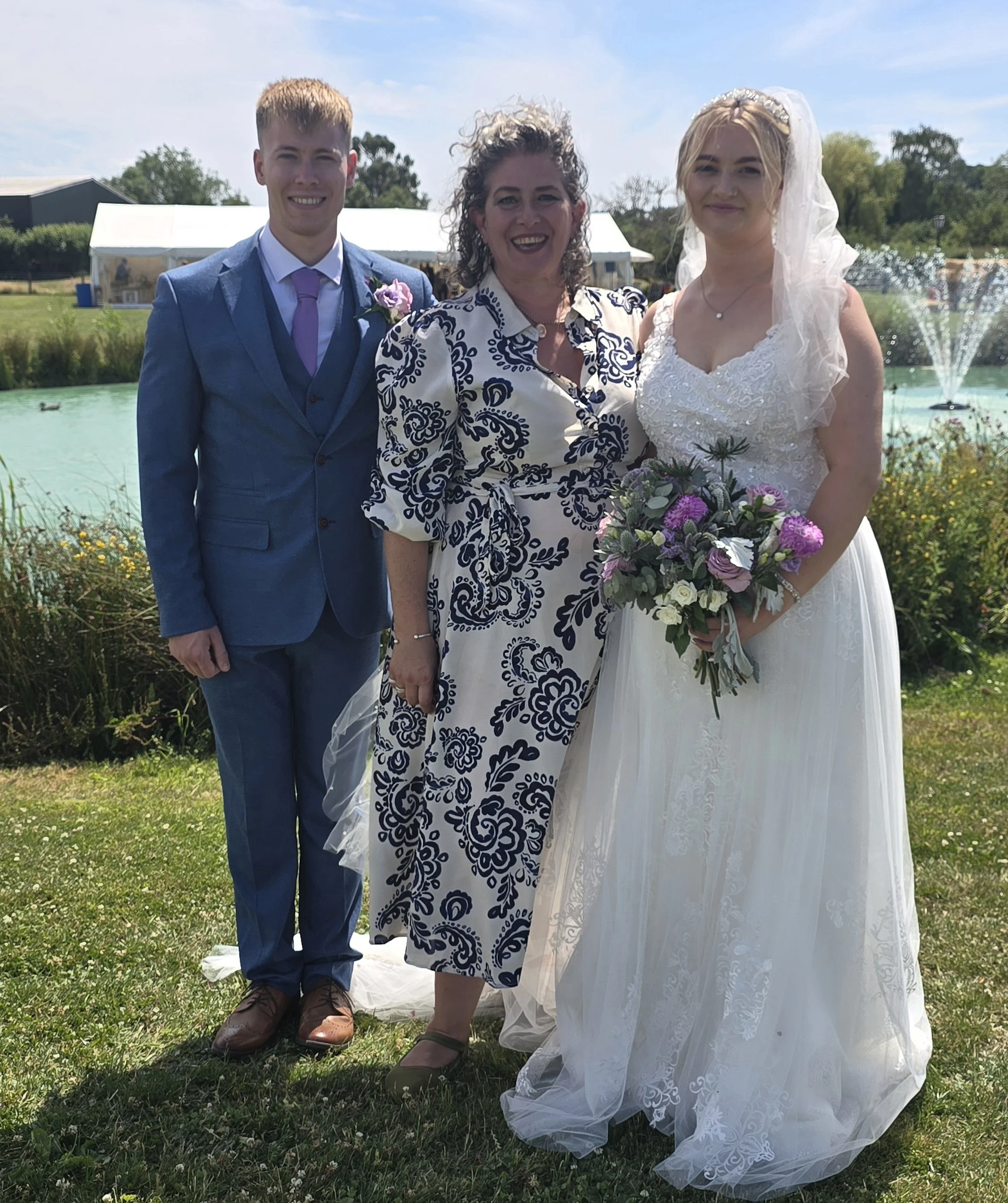 NaomiJane with Holly and Charlie, a young couple who were recommended her as a celebrant after the Bride's brother recommended NaomiJane. They married on the Somerset Levels at a family farm by a lake.