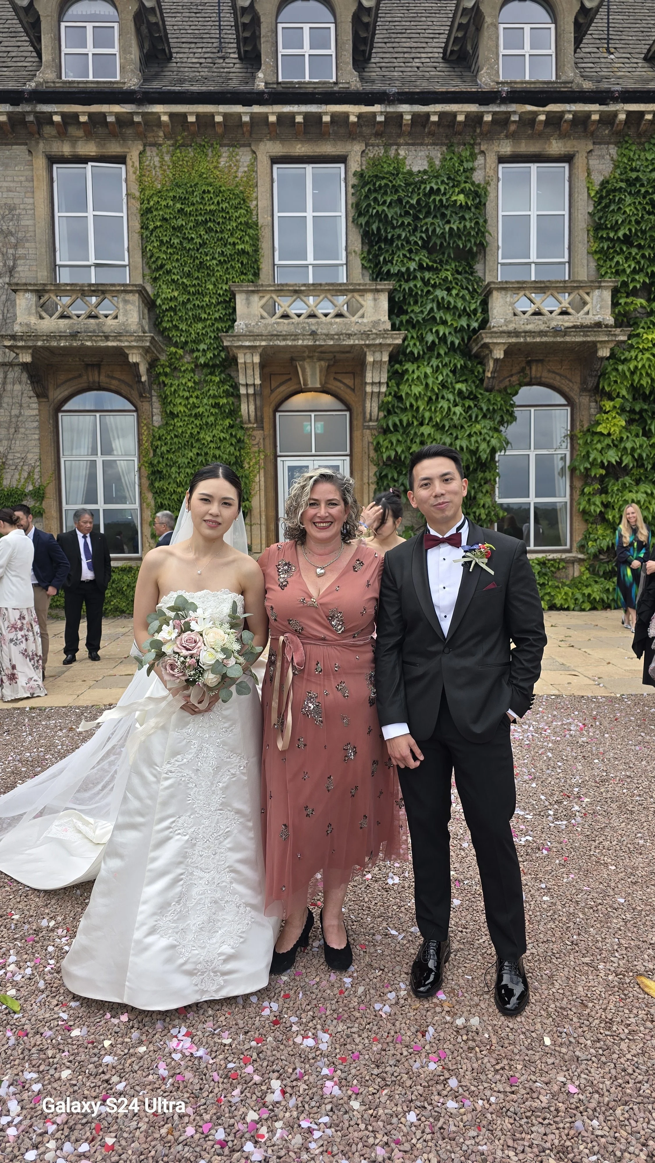 NaomiJane with her lovely bride and groom at Eastwood Park near Bristol. The couple had their lovely guests and big dog Gilbert in attendance. They had a handfasting after the ceremony and then the Chinese tea ceremony for their parents afterwards.