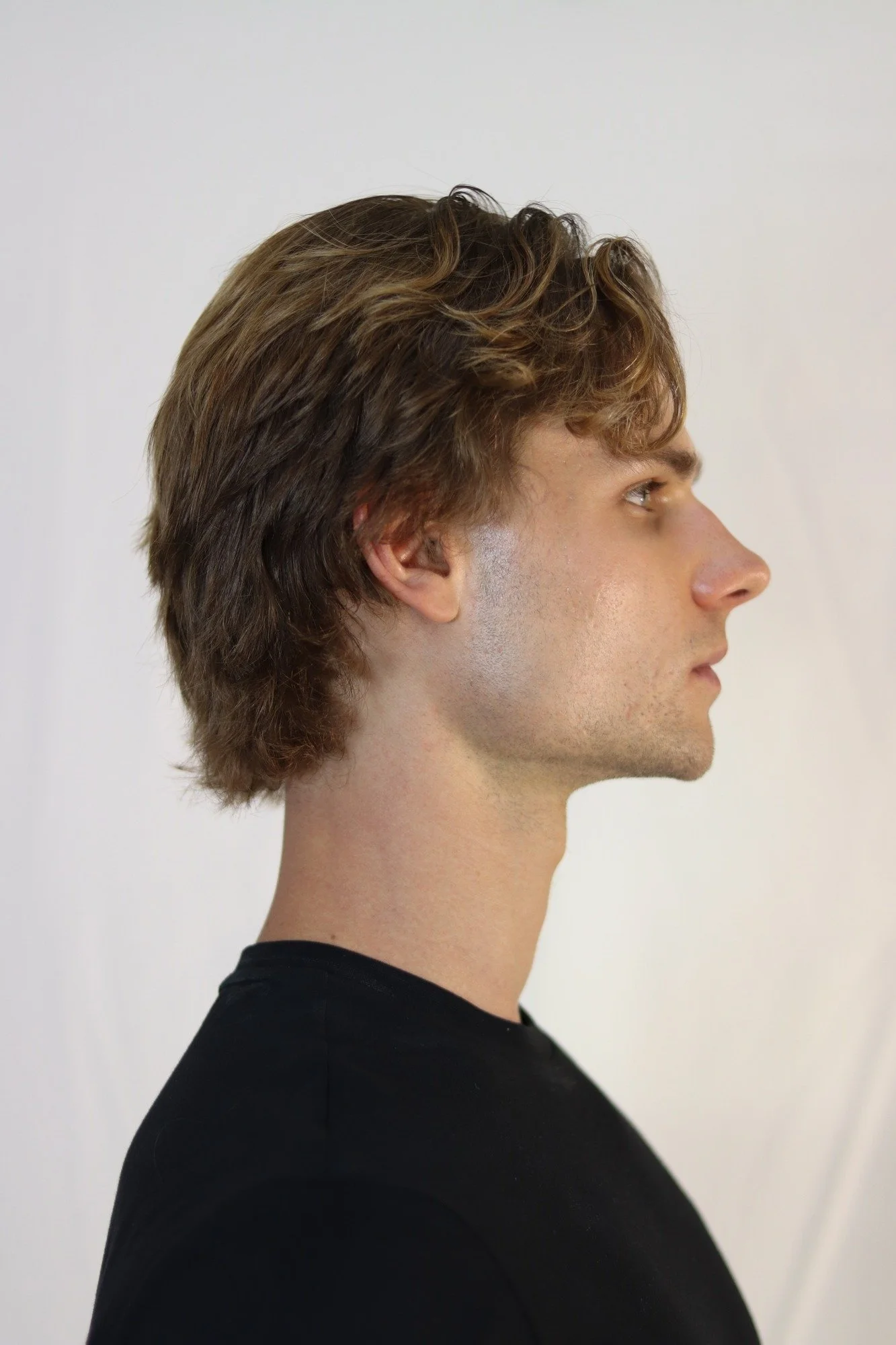 Stepan Salomatin — side-profile headshot. Current unretouched digital.