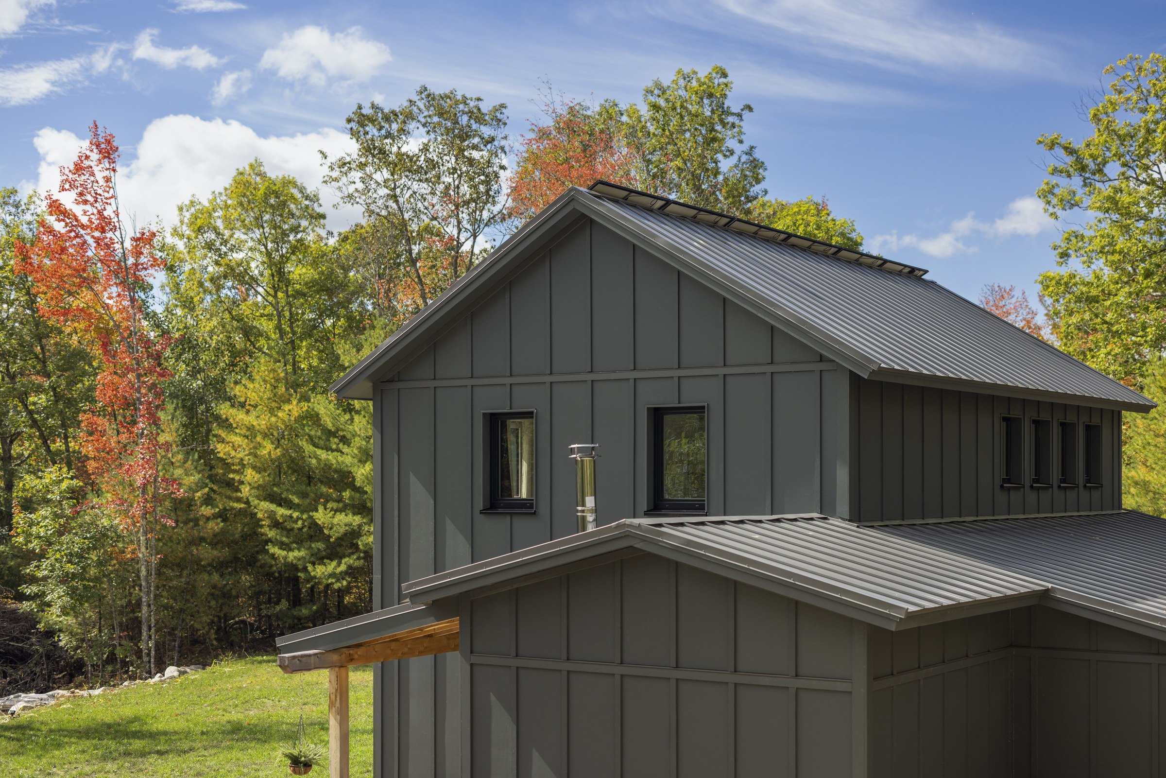 Metal roof and upper-story siding details at the Lyman Residence.