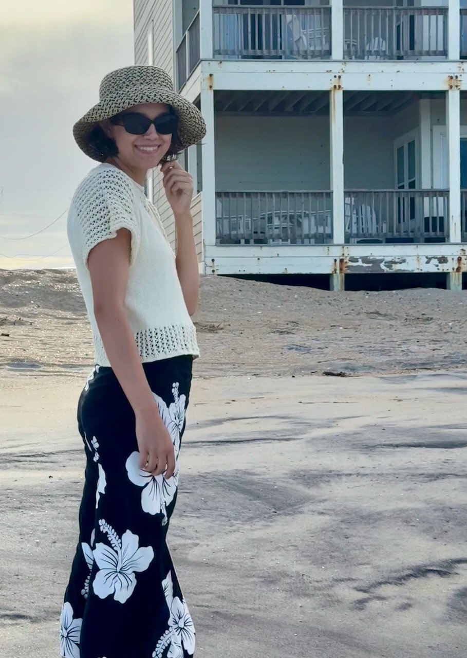 Chic summer knit top with a breezy lace yoke and delicate lace trim, perfect for effortless beach fashion. This lightweight, short-sleeved sweater drapes beautifully for a relaxed yet elegant look.