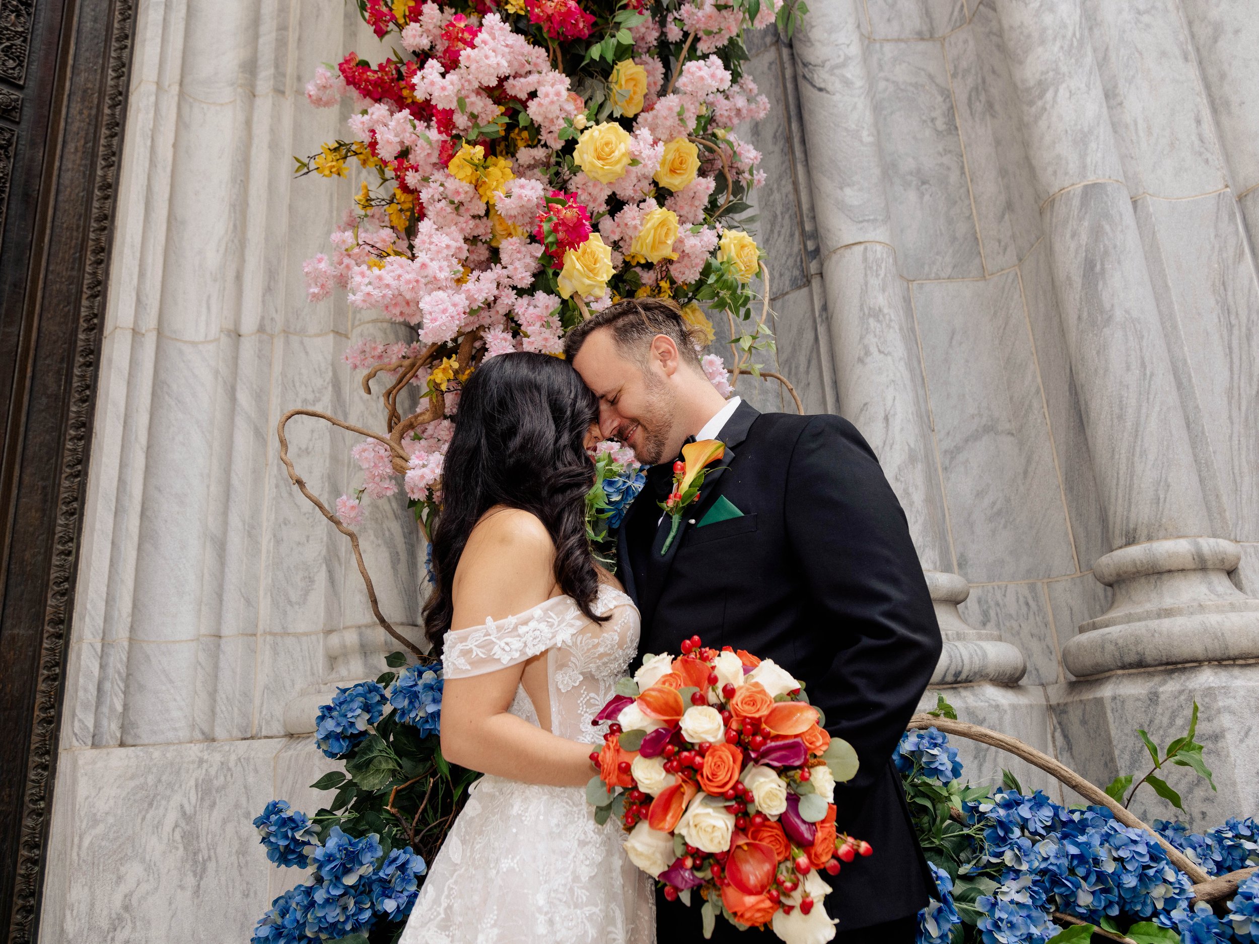 Radiant newlyweds outside St. Patrick's Cathedral after the wedding ceremony, capturing a magical moment of celebration and love.