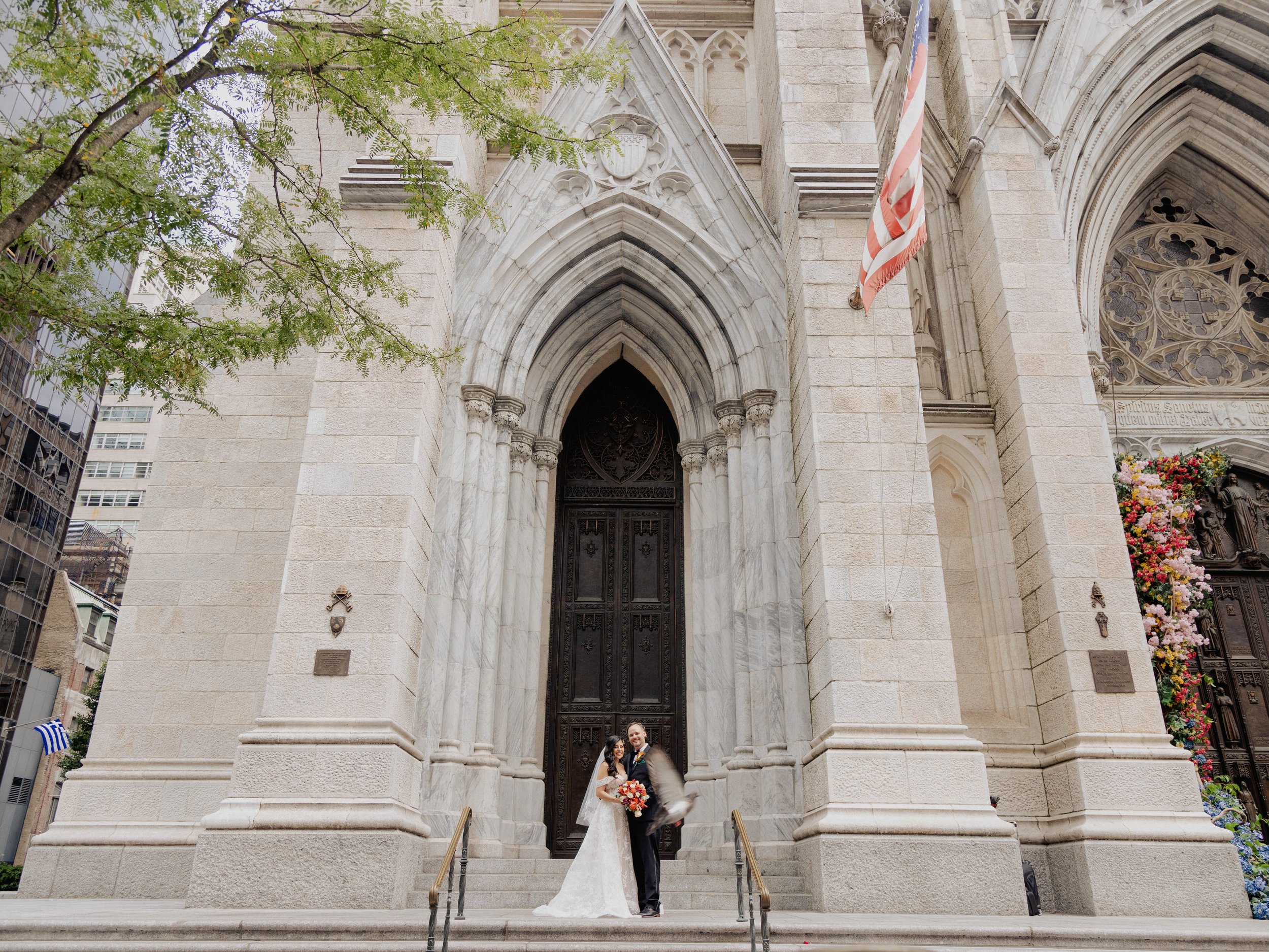 Radiant newlyweds outside St. Patrick's Cathedral after the wedding ceremony, capturing a magical moment of celebration and love.