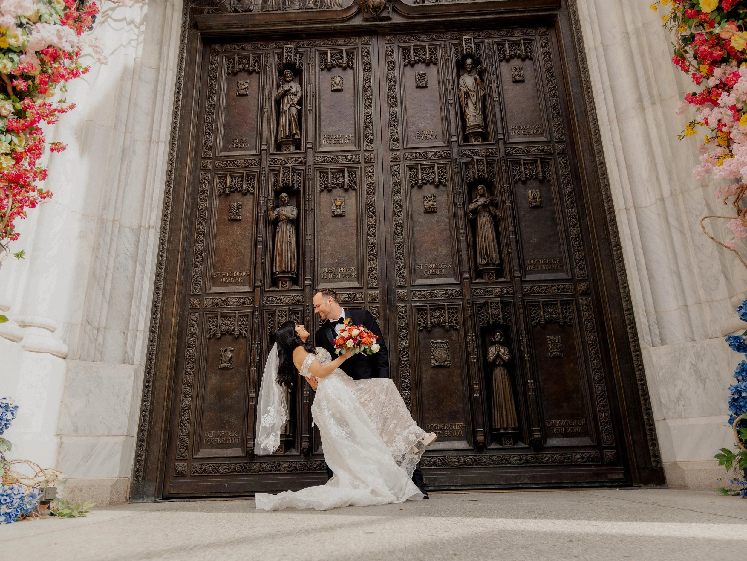 Radiant newlyweds outside St. Patrick's Cathedral after the wedding ceremony, capturing a magical moment of celebration and love.