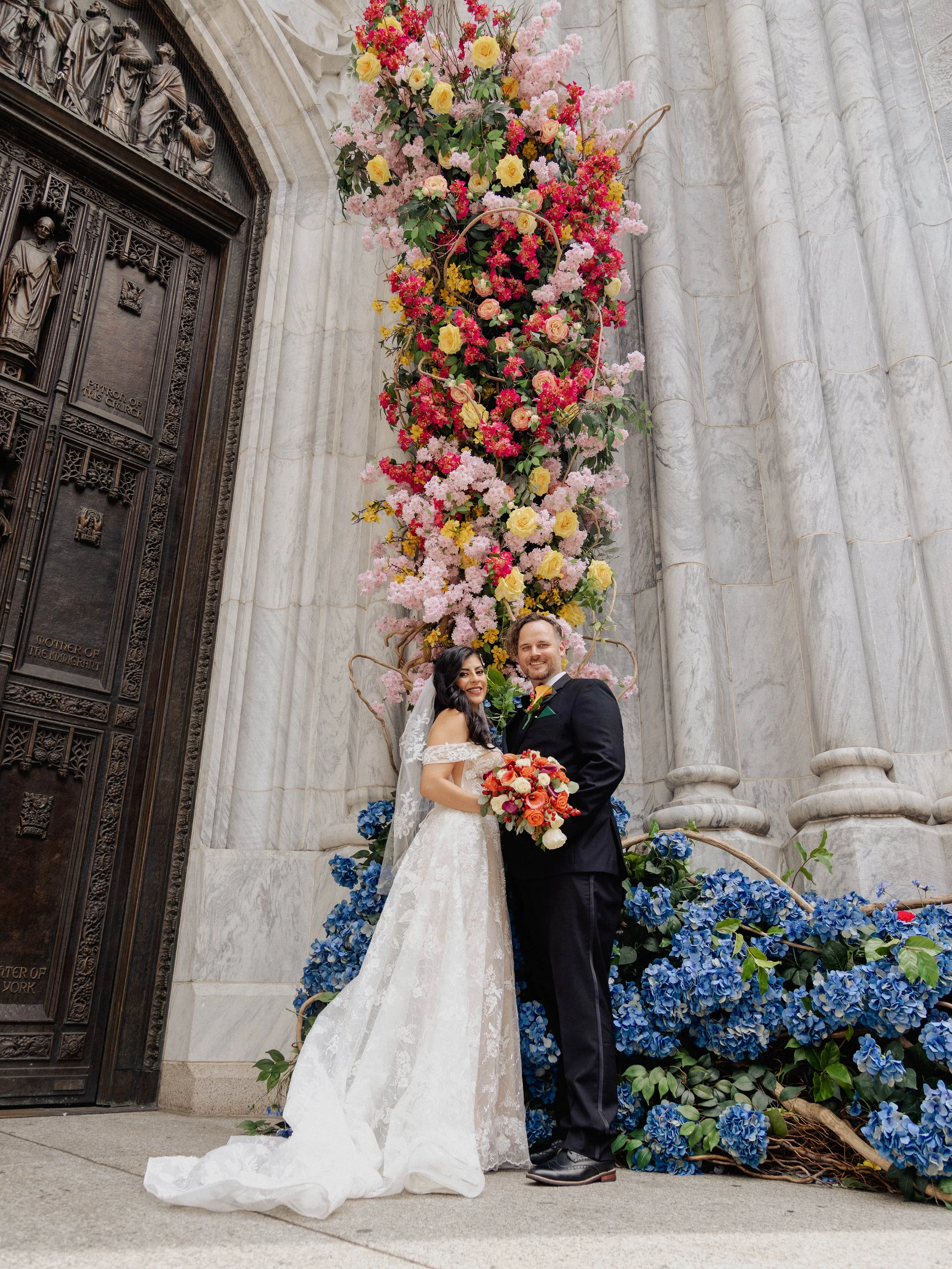 Radiant newlyweds outside St. Patrick's Cathedral after the wedding ceremony, capturing a magical moment of celebration and love.