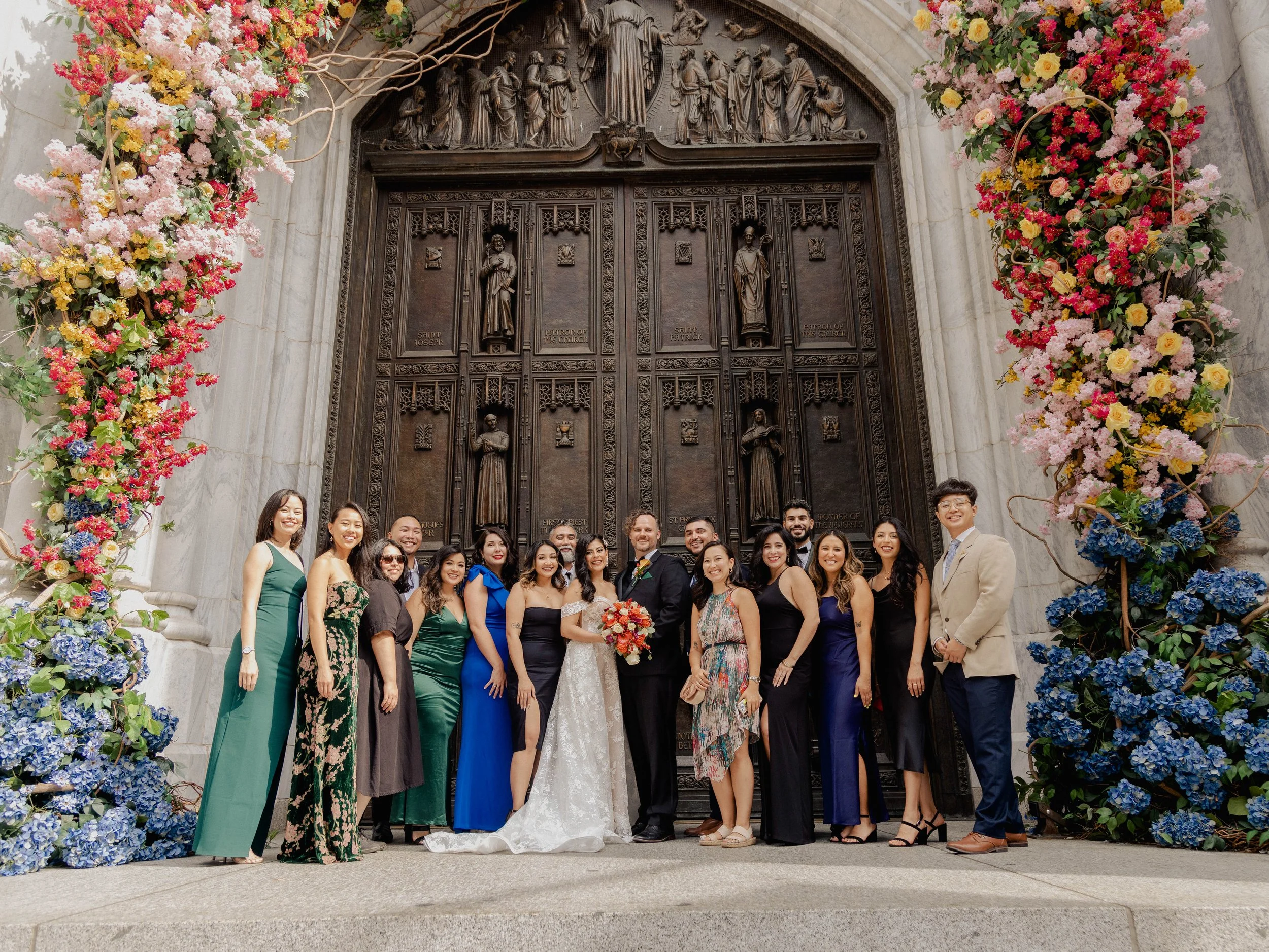 Radiant newlyweds and joyful guests gather outside St. Patrick's Cathedral, capturing a magical moment of celebration and love.