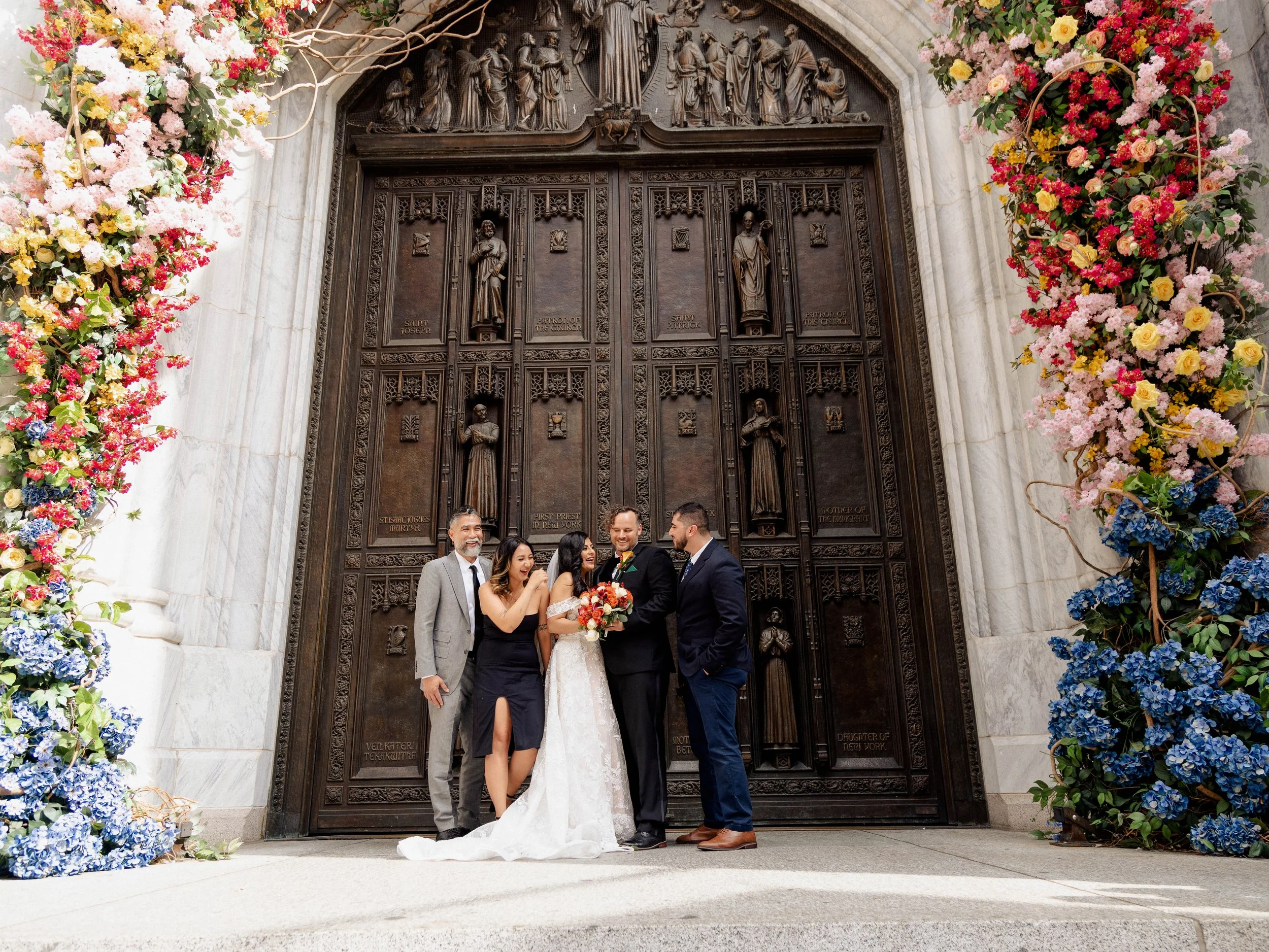 Radiant newlyweds and joyful guests gather outside St. Patrick's Cathedral, capturing a magical moment of celebration and love.