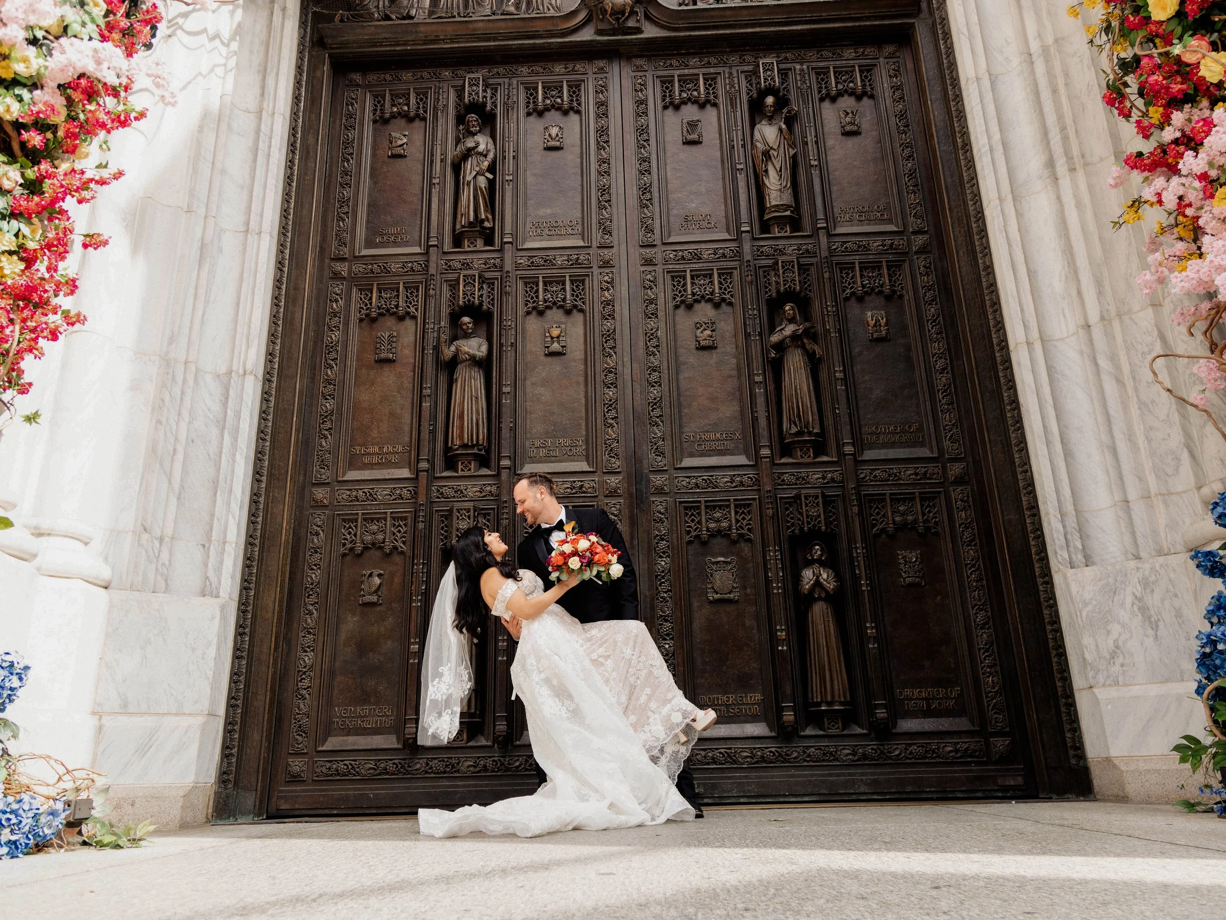 Radiant newlyweds outside St. Patrick's Cathedral after the wedding ceremony, capturing a magical moment of celebration and love.