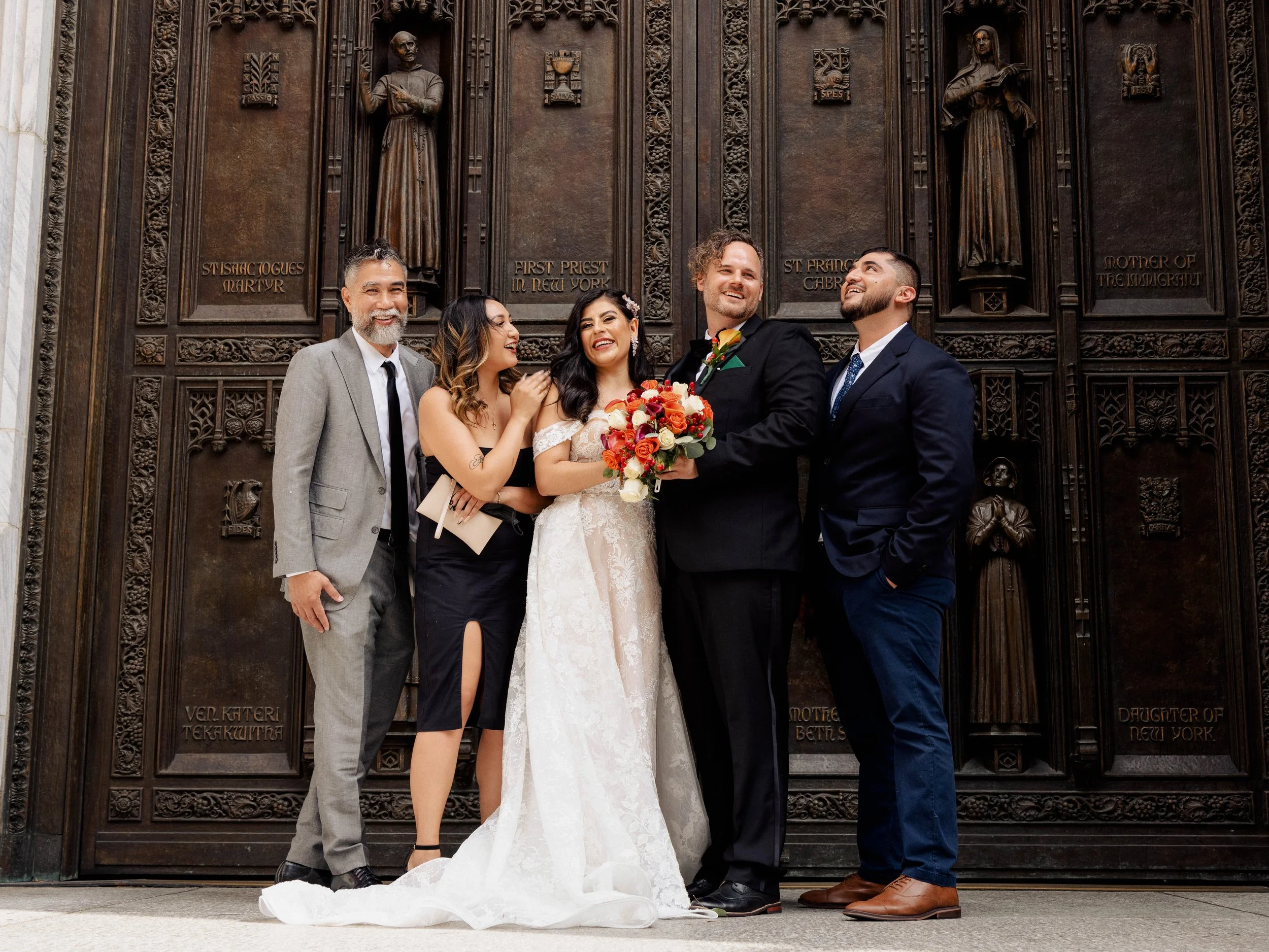 Radiant newlyweds and joyful guests gather outside St. Patrick's Cathedral, capturing a magical moment of celebration and love.