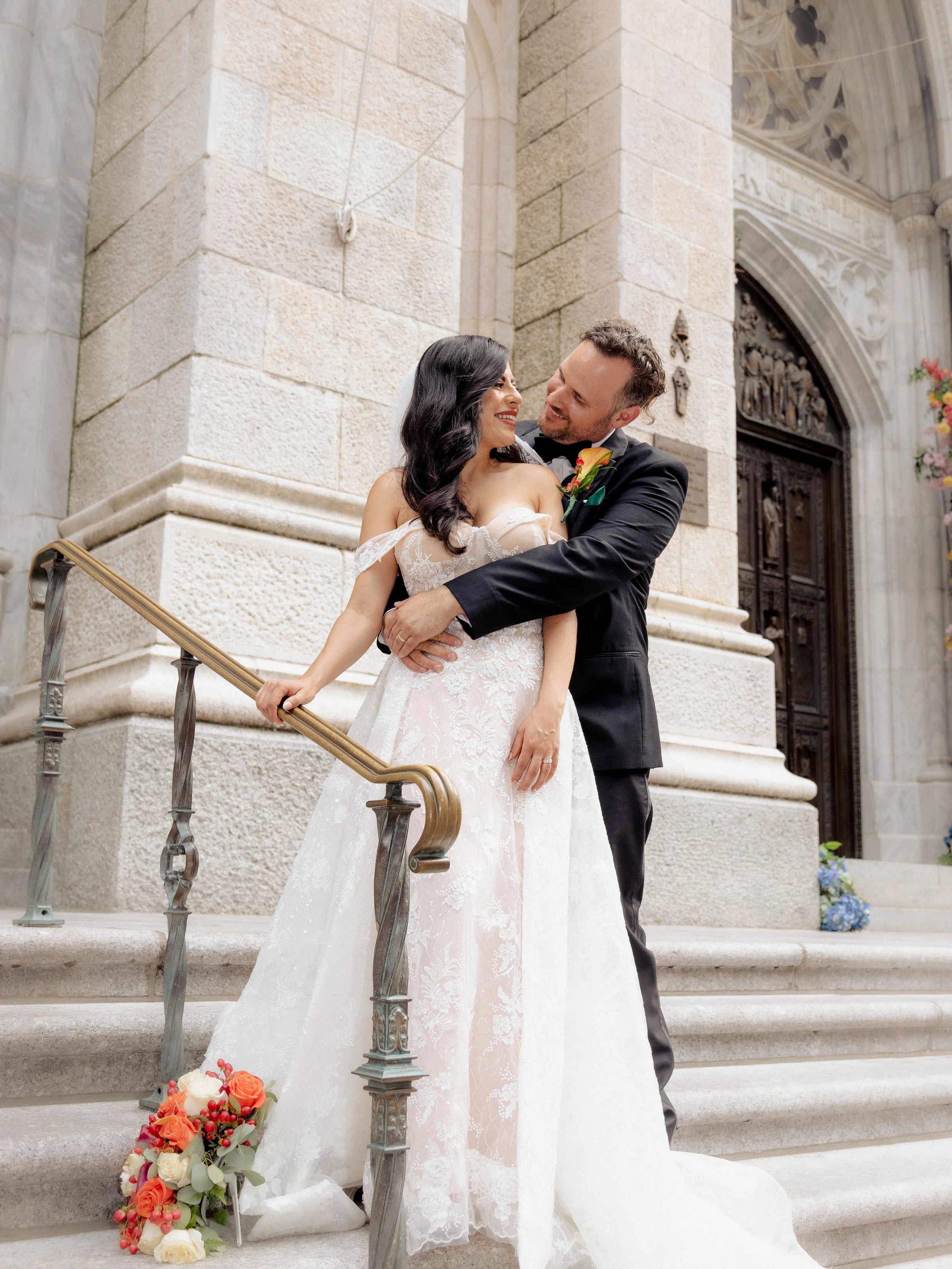 Radiant newlyweds outside St. Patrick's Cathedral after the wedding ceremony, capturing a magical moment of celebration and love.