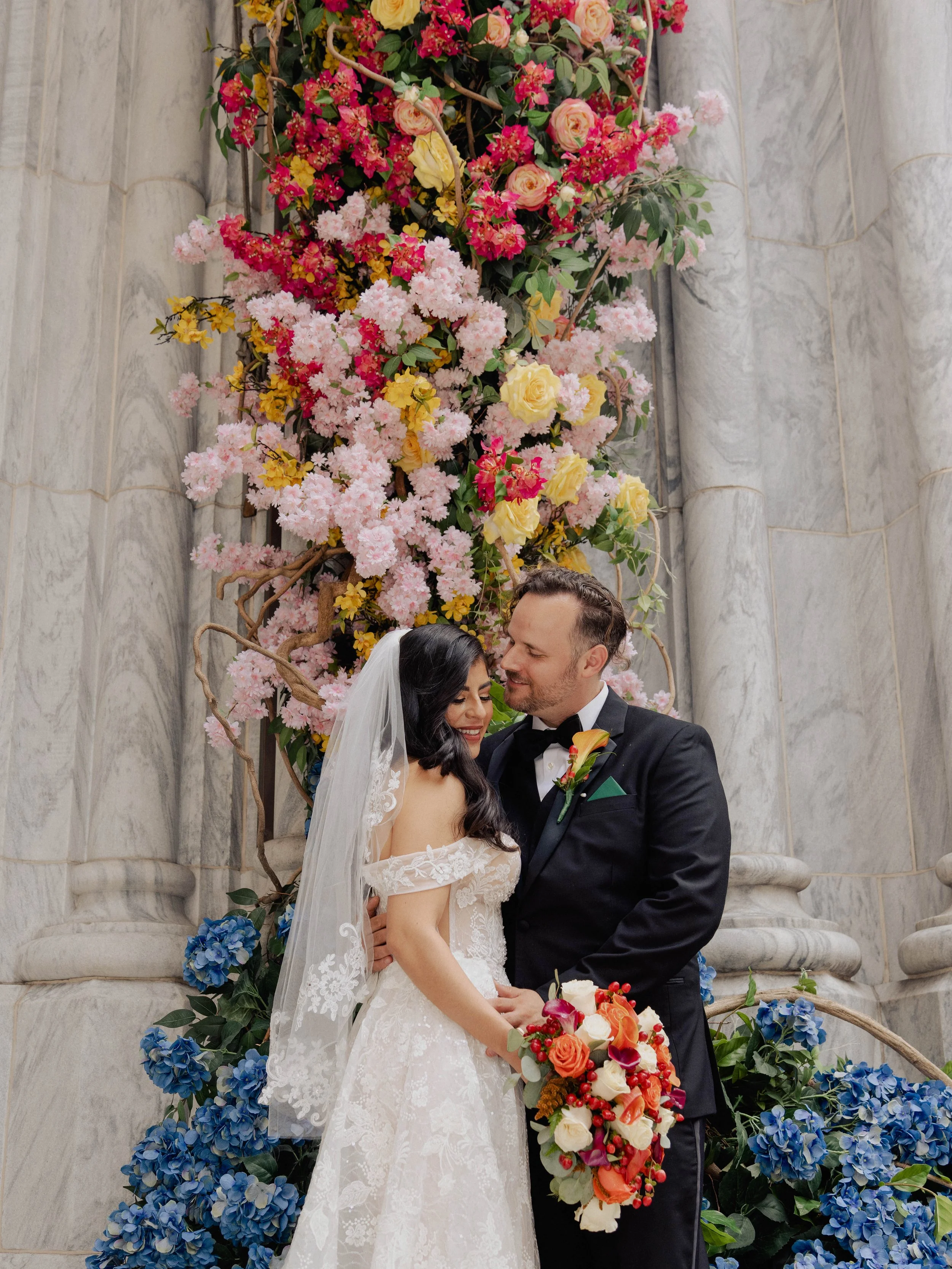 Radiant newlyweds outside St. Patrick's Cathedral after the wedding ceremony, capturing a magical moment of celebration and love.