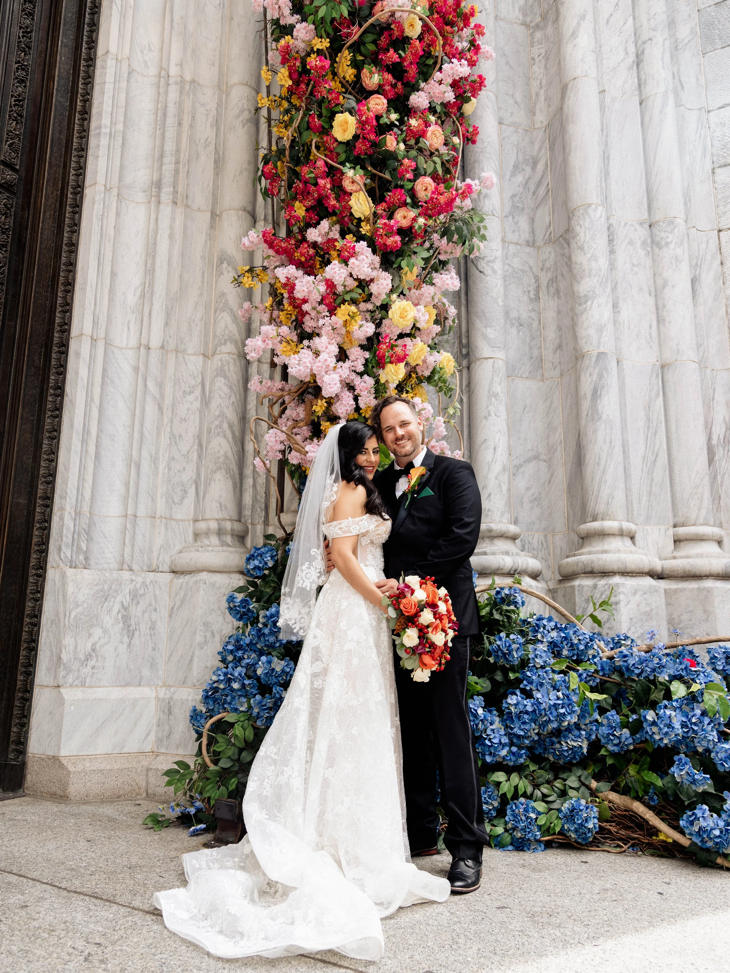 Radiant newlyweds outside St. Patrick's Cathedral after the wedding ceremony, capturing a magical moment of celebration and love.