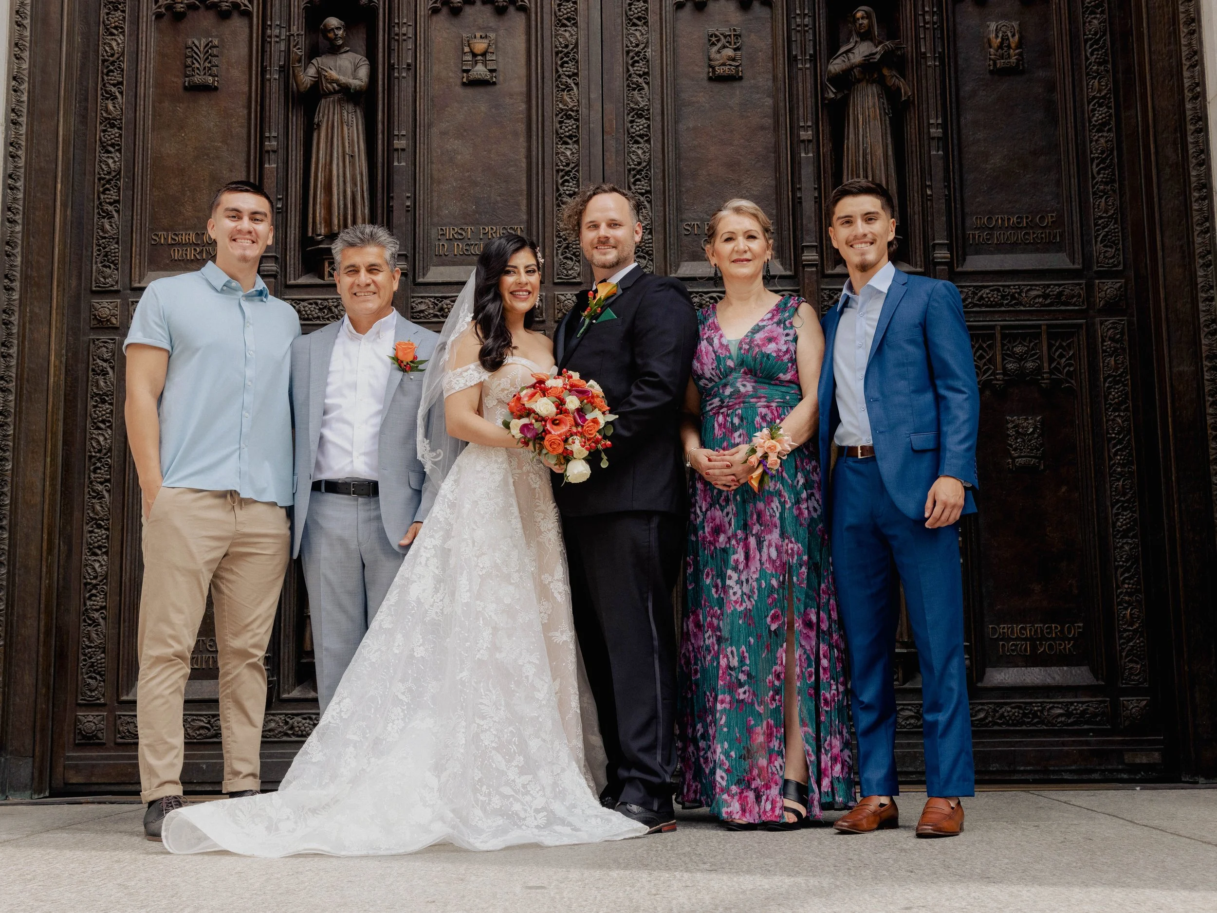 Radiant newlyweds and joyful guests gather outside St. Patrick's Cathedral, capturing a magical moment of celebration and love.