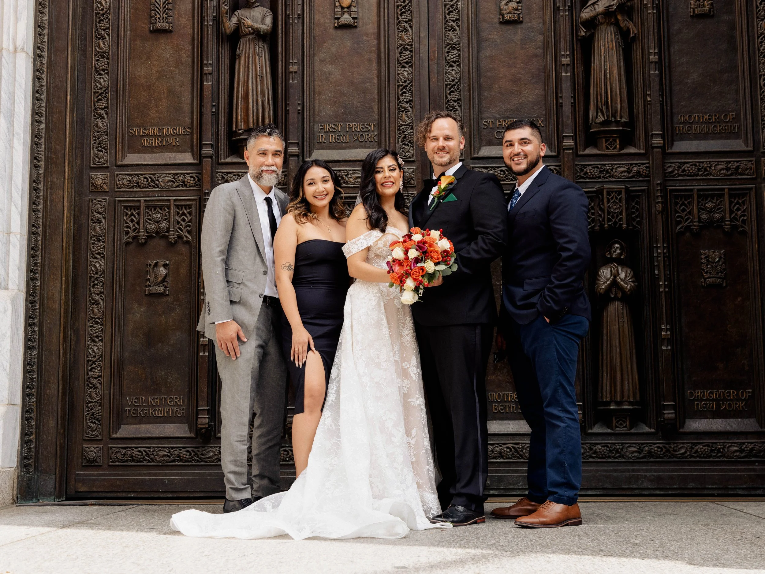 Radiant newlyweds and joyful guests gather outside St. Patrick's Cathedral, capturing a magical moment of celebration and love.