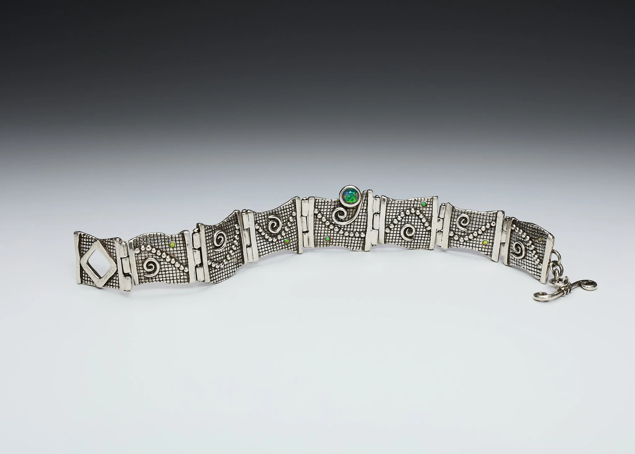 Hinged Bracelet with opals by Donna Yutzy of Some Girls Jewelry