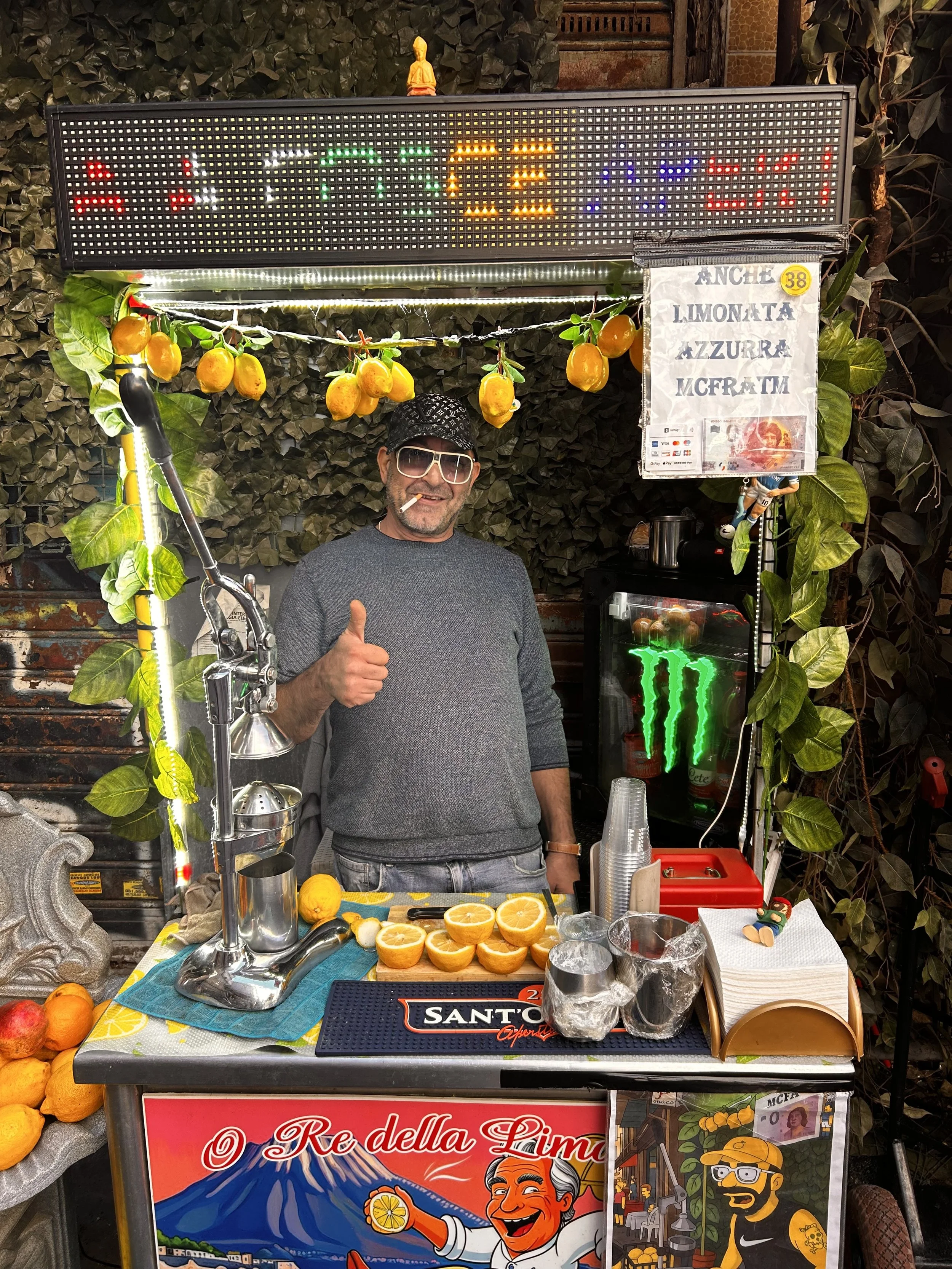 man smoking giving thumbs up sign selling limoncello
