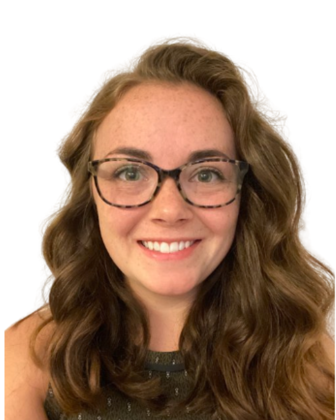 A person with wavy brown hair and glasses smiling at the camera against a plain white background.