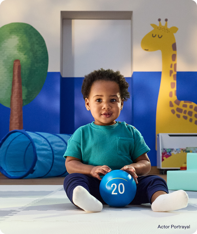 Actor-Portrayal-of-a-baby-playing-with-a-ball-in-a-play-room-53563329245709-1660338.png