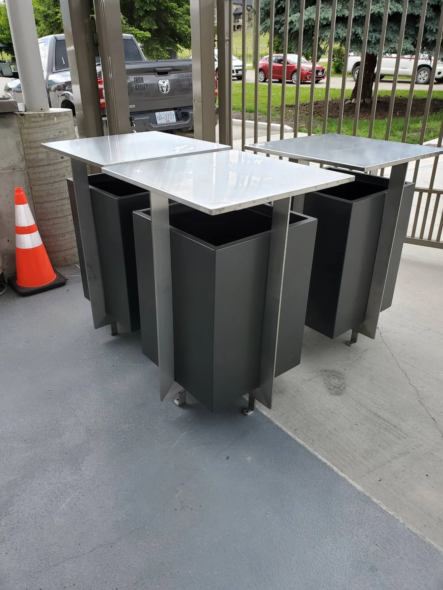 aluminum and stainless steel garbage receptacles